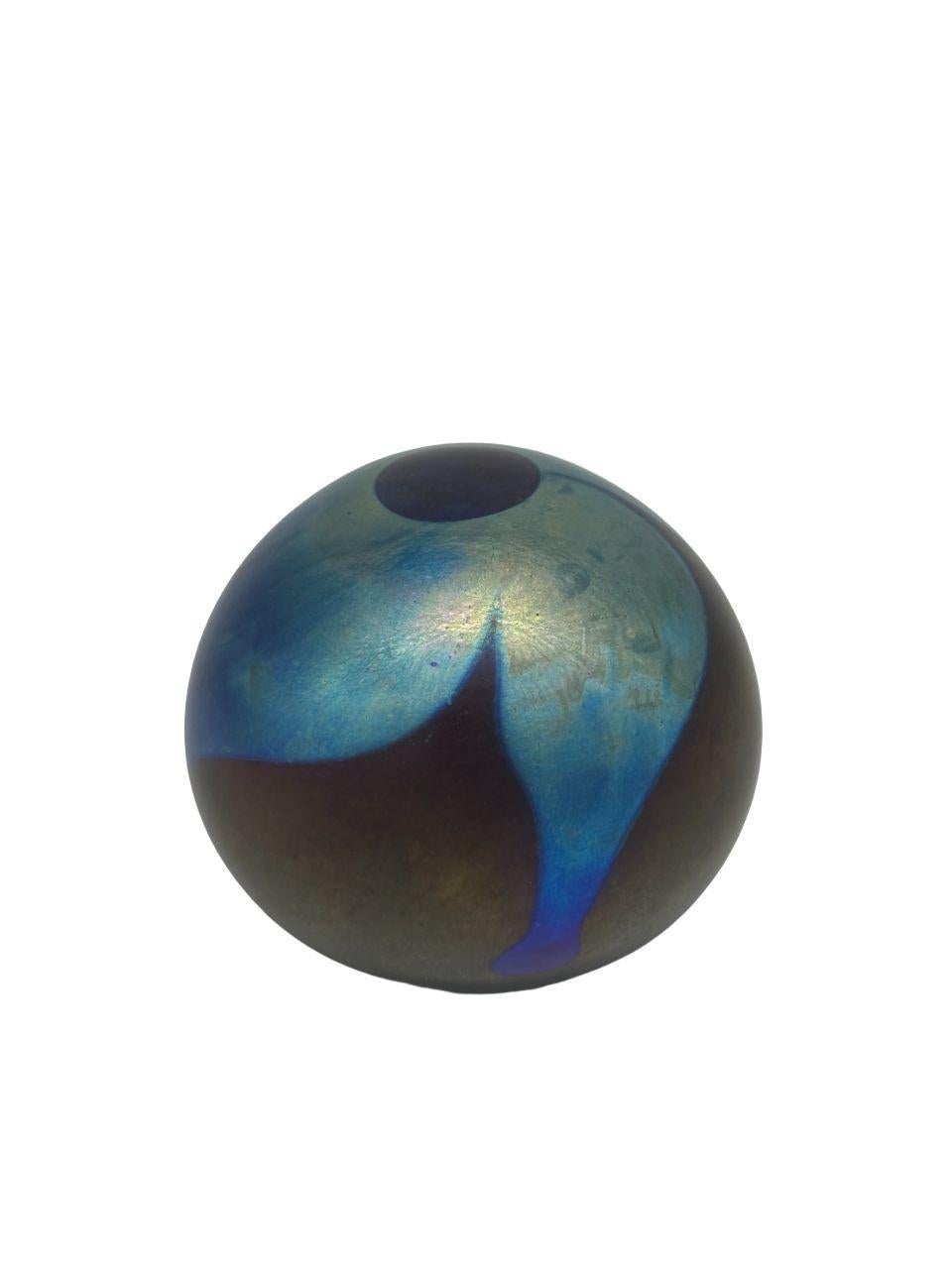 This exceptional 1975 John Barber Studio Art Glass Swirl Paperweight Weight stands out as a rare find with its distinctive blue chrome hues. The piece is not only signed by the renowned artist John Barber but also showcases a captivating swirl