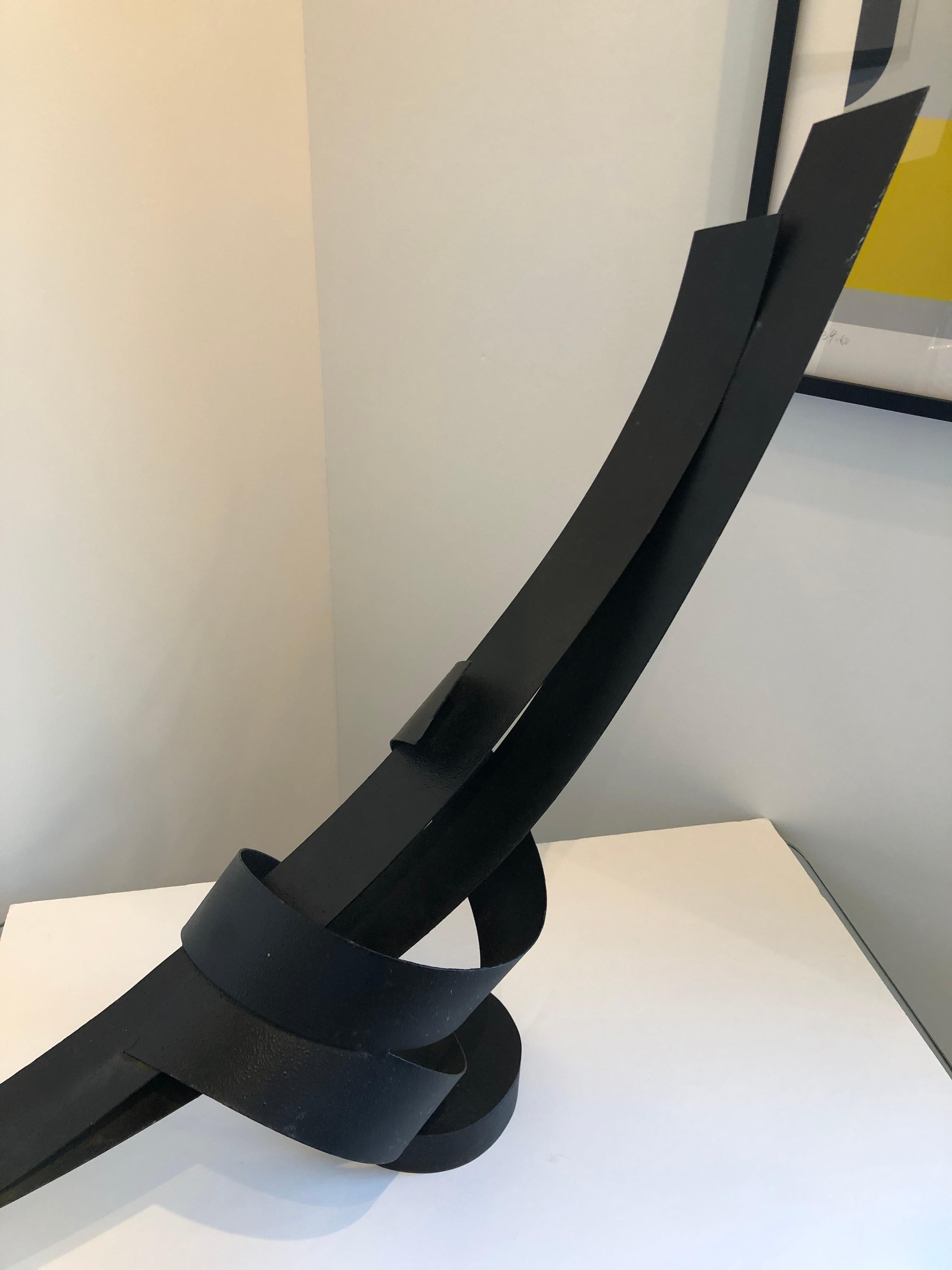 Offered is a signed 20th century abstract sculpture in black textured iron by Philadelphia artist, John Roper. Each of John Roper's sculptures is a unique design of direct metal sculpture, forged and welded by the artist in his studio. The scale of