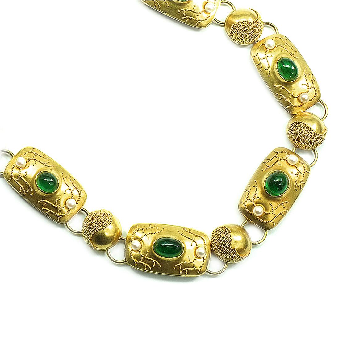 Signed 9 carat natural emerald pearl and 18K gold granulation choker necklace, circa 1930

This decorative choker necklace is designed as round and rectangular links, featuring 10 natural emerald cabochons, richly decorated with fine gold