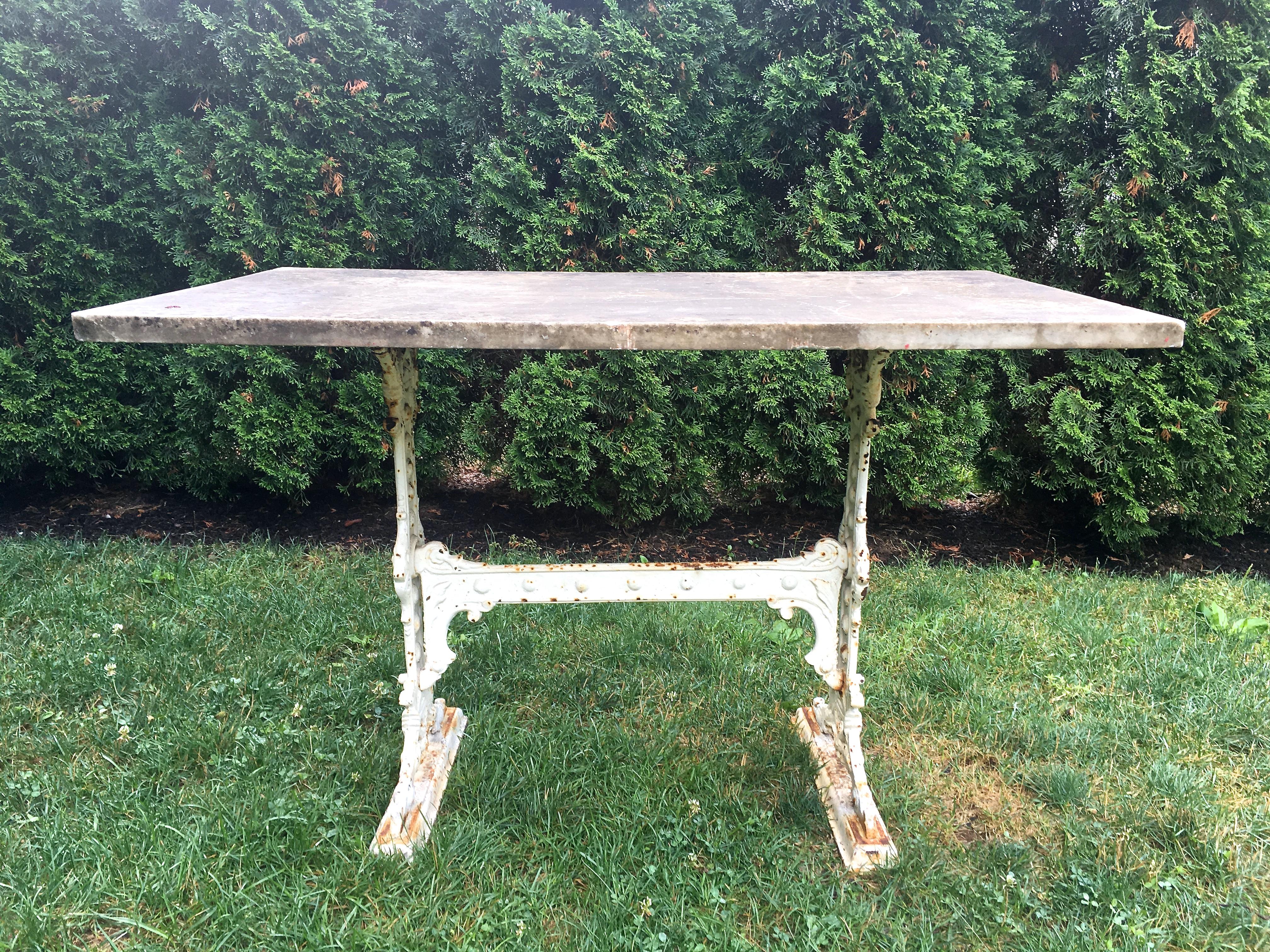 This is a gorgeous table, made even more so by the large, original marble top that is bolted to the base. Originally white in color, the marble has flourished for 140 years outside and has a marvellous grey sugared patina, with only a few scratches