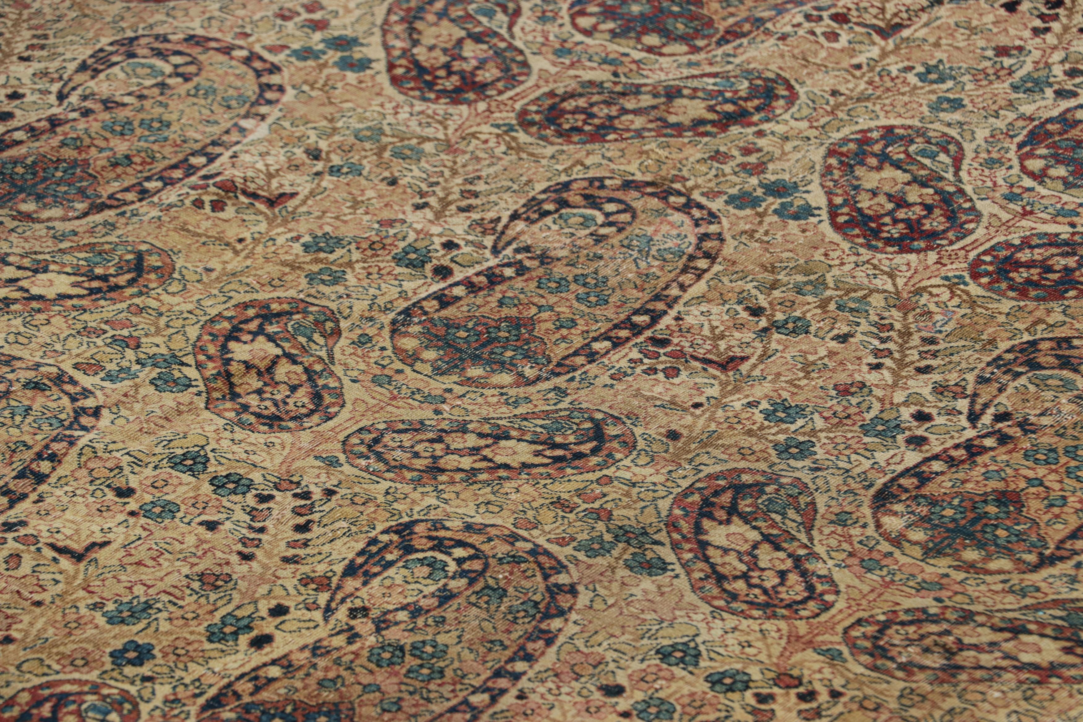 Made with hand-knotted wool circa 1880-1890, this 7x10 antique Persian rug is a signed collectible and rare exemplar of the works of master weaver Aboul Ghasem Kermani—a historic name in Kerman Lavar rugs, both one of the most important workshops of