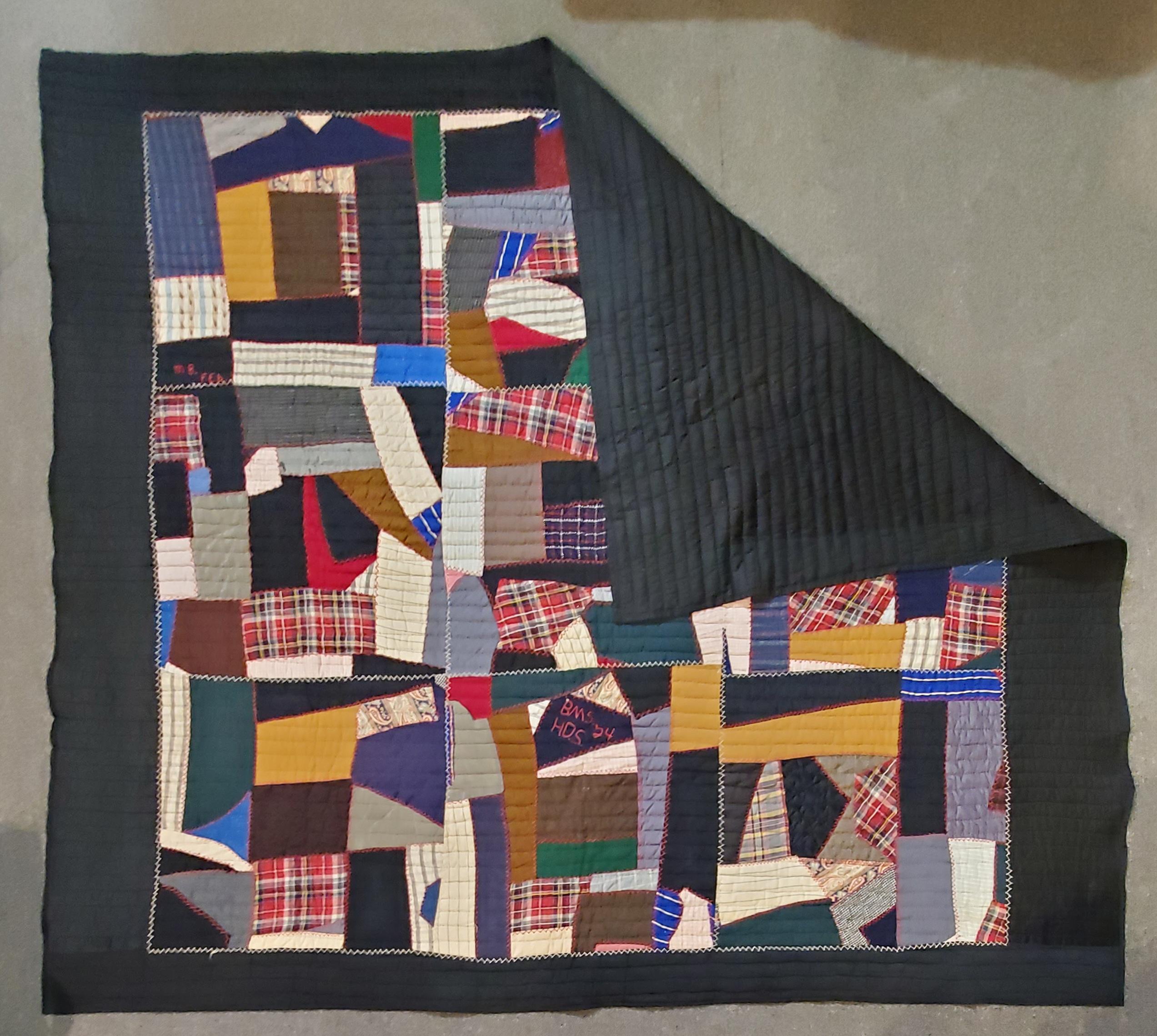 This fine crazy quilt made of velvet and wool with a sateen border and backing. Fine piecing and signed and dated 1924. The condition is very good.