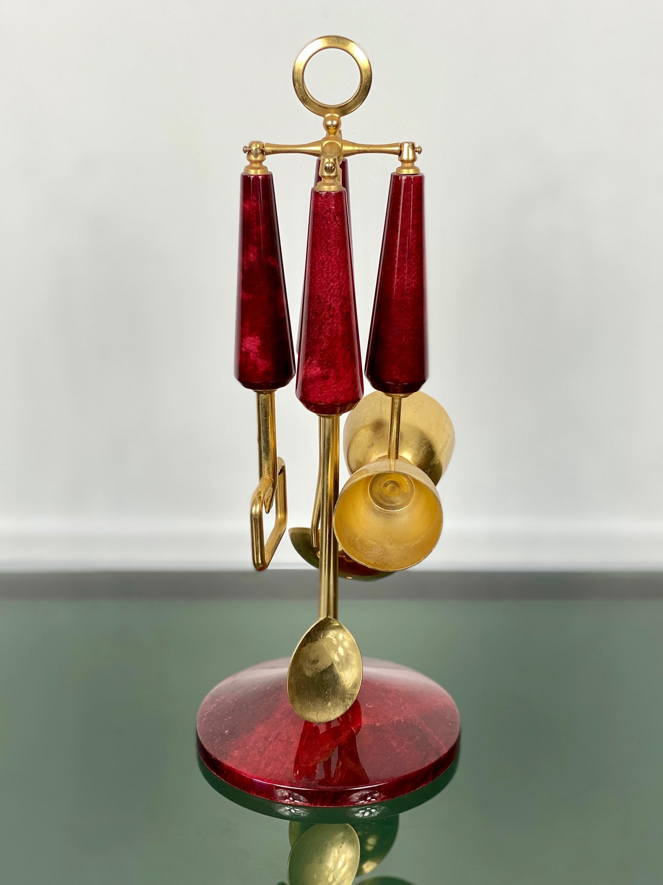 Wonderful bar set of Aldo Tura in lacquered goatskin. Signed with its original label on the bottom.

This set was executed, circa 1960 in a red parchment. Along with artists like Piero Fornasetti and Carlo Bugatti, Aldo Tura (1909-1963) definitely