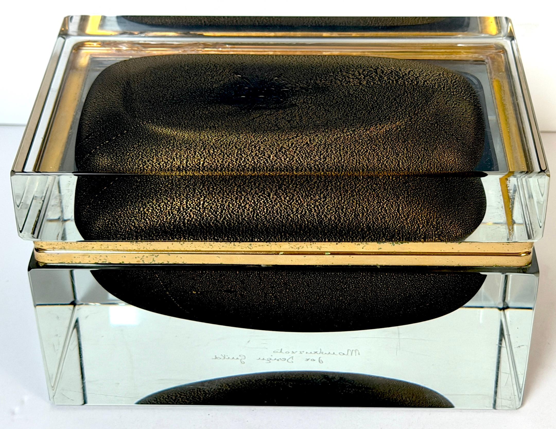 Signed Alessandro Mandruzzato for Design Guild Murano Sommerso Faceted Glass Box, 1970s

A striking sculptural Murano glass box signed “Mandruzzato for Design Guild,” showcasing the celebrated faceted-block technique perfected by the Mandruzzato