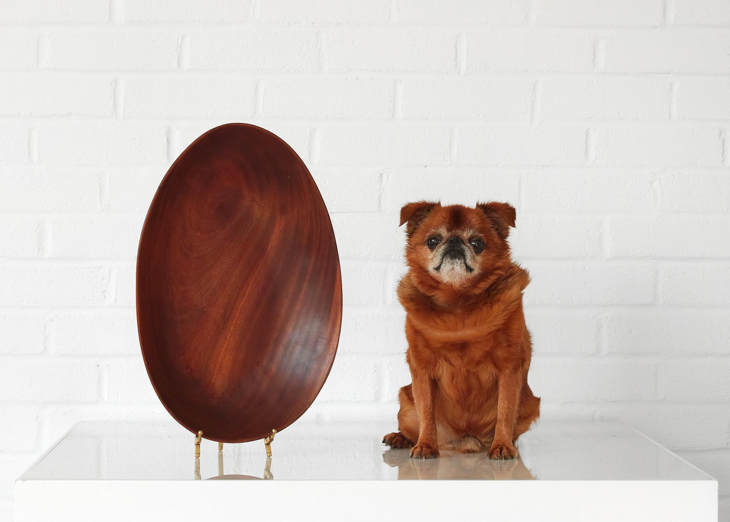 For your consideration is this signed American studio hand-carved bowl featuring original finish, beautifully figured grain, organic egg-shaped form, rich warm tone, and artist's signature. The bowl is generously proportioned at 16 inches by 10.5
