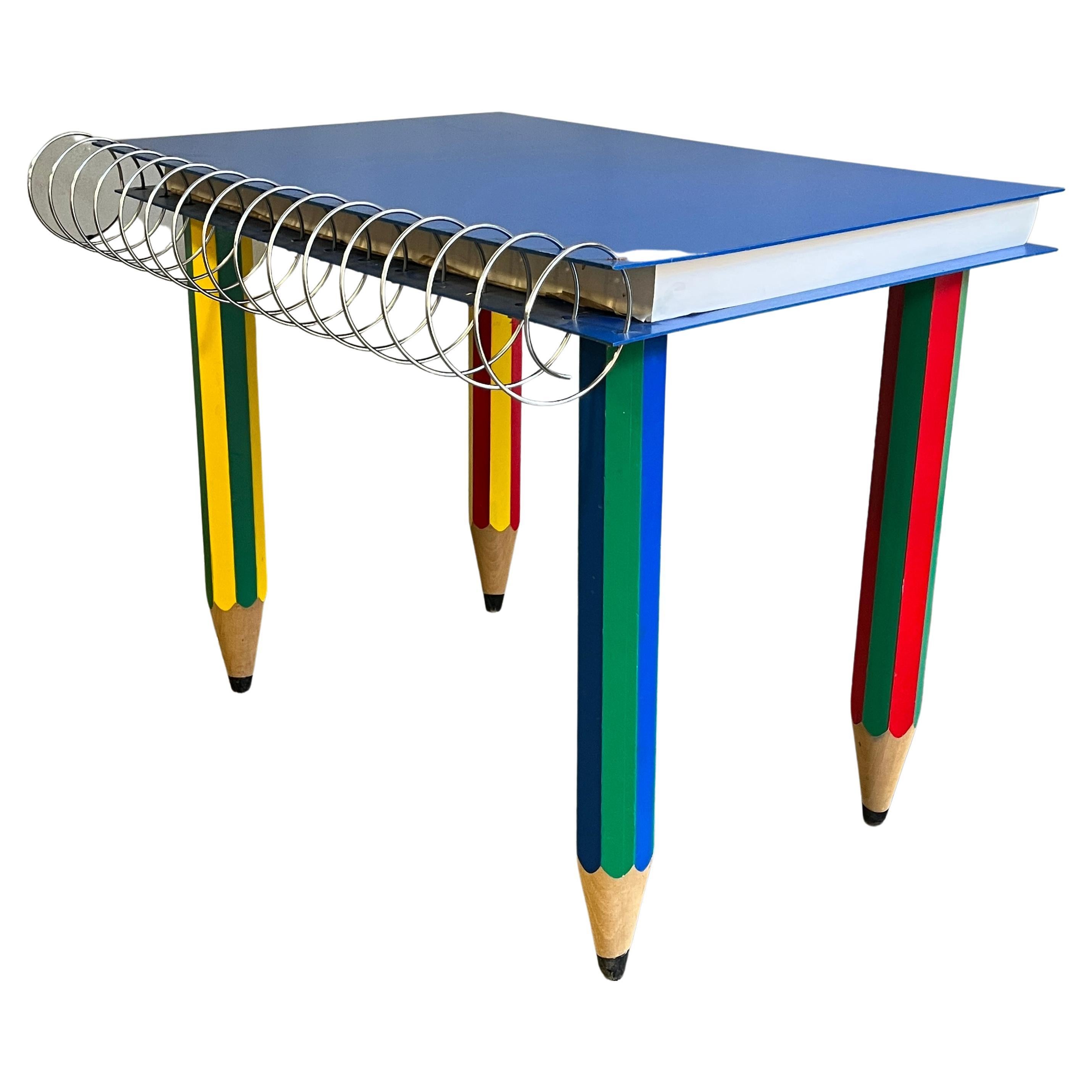 A rare Post Modern Memphis Milano style table or desk designed by artist Pierre Sala circa 1980's. Large and functional notebook on solid wood legs. Paper can easily be replaced. 

Some wear consistent with age and use.
