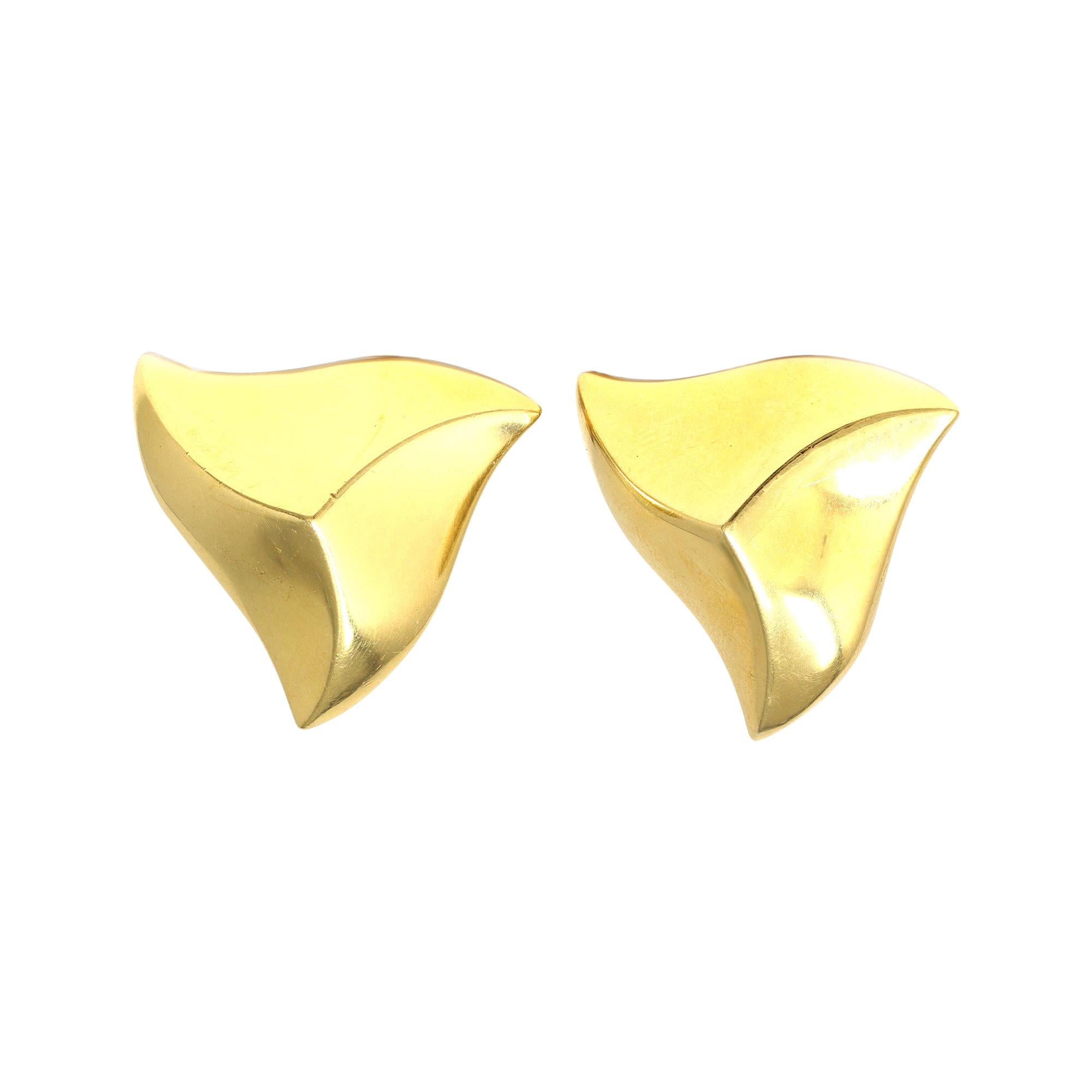 A unique pyramidal shape clip-on earrings by the iconic designer Angela Cummings, circa 1990. The earrings have posts and omega backs. They are set in 18-karat polished yellow gold and have a gross weight of  33.4 grams. They measure 1.21 inches