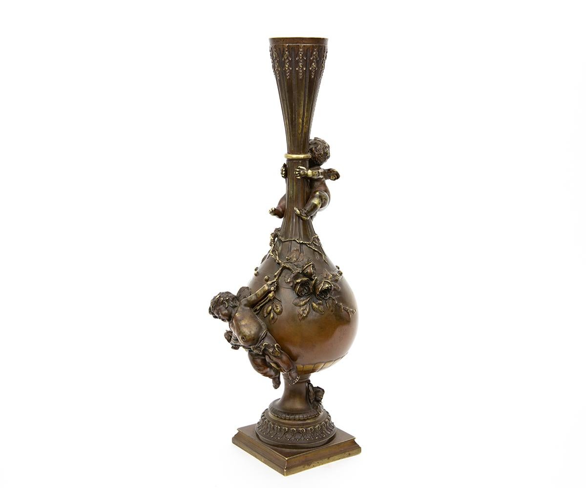 A 19th century French Vase by celebrated French artist Louis Moreau. This truly remarkable vase offers an aesthetically pleasing artwork of a continuous scene of Putti/Cherubs straddling the outer vase with rose branches. It is a stunning piece for