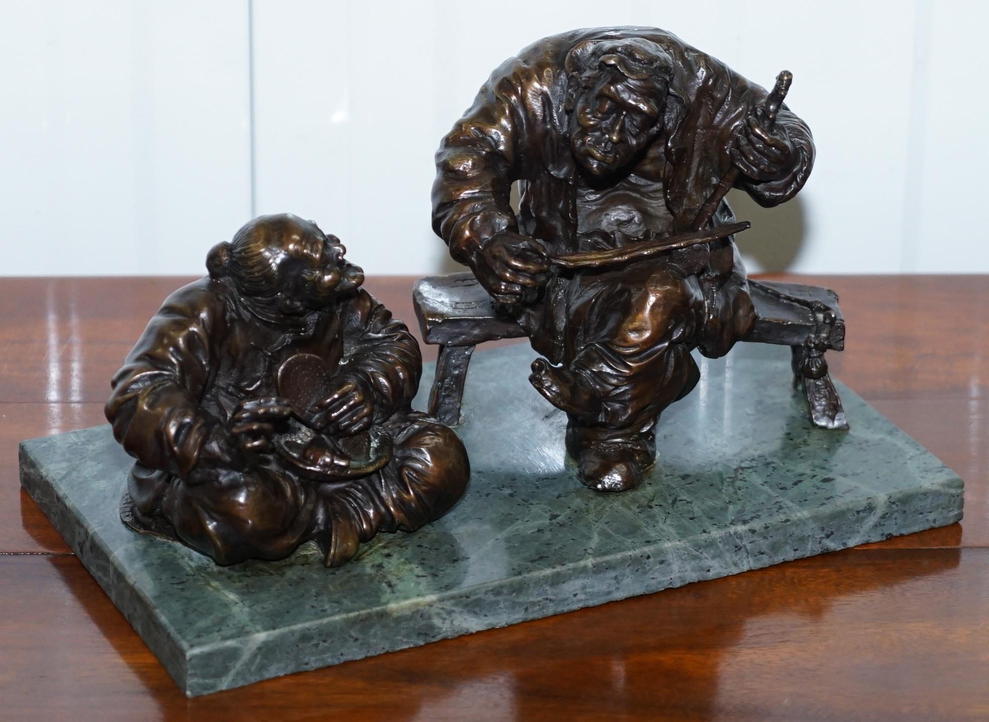 We are delighted to offer for sale this stunning medium sized bronze statue of two Chinese men on a solid green soapstone base signed Aug Mariton.

A very decorative and good sized piece, the Chinese chaps seem to be of humble origins, one is