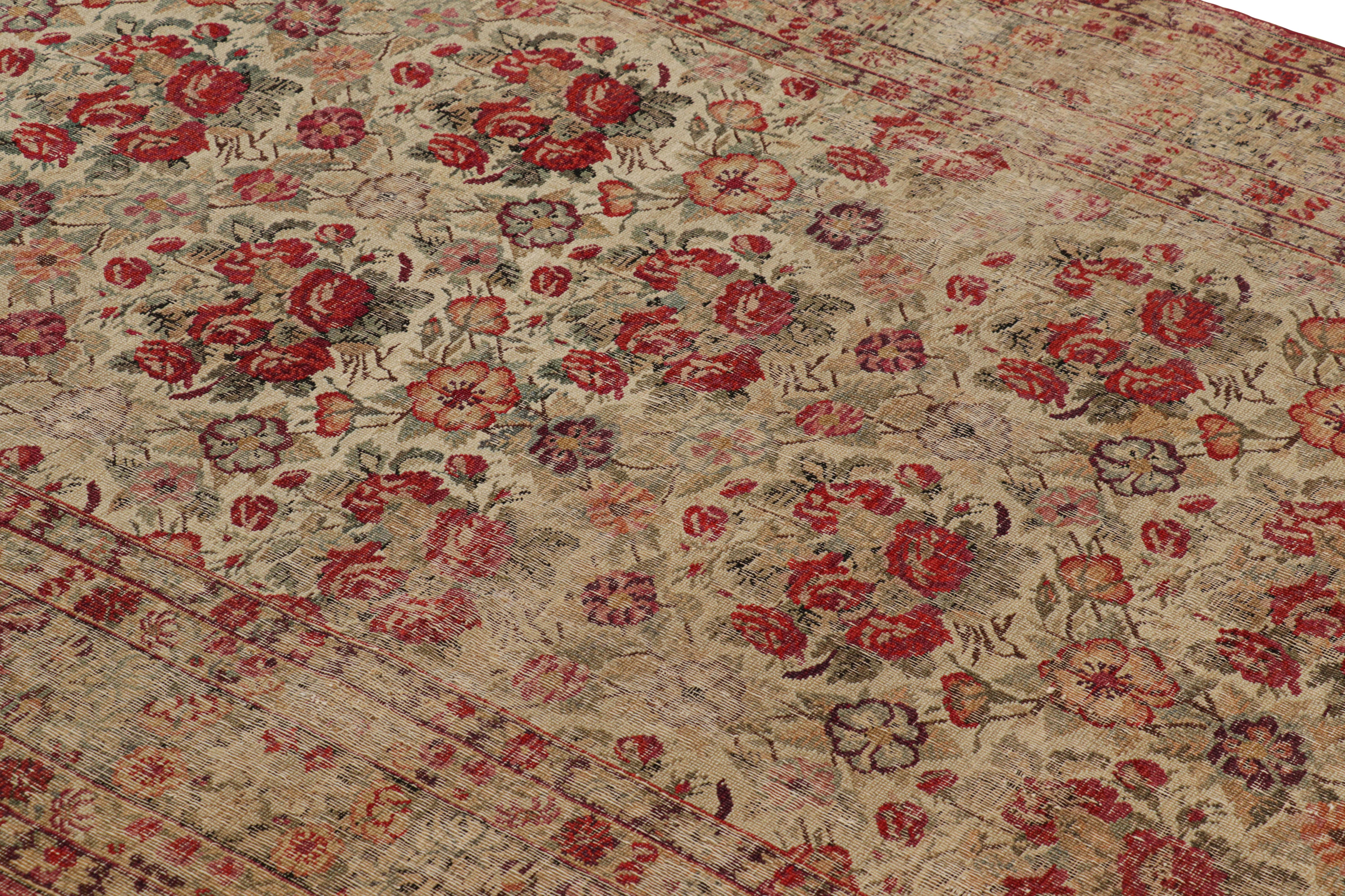 Hand-knotted in wool circa 1870-1880, this 5x8 antique Persian rug is a remarkable signature piece from Tehran, more than 140 years old. Its features beige underscores floral patterns in motifs and impressionistic bouquets; a lovely design like few