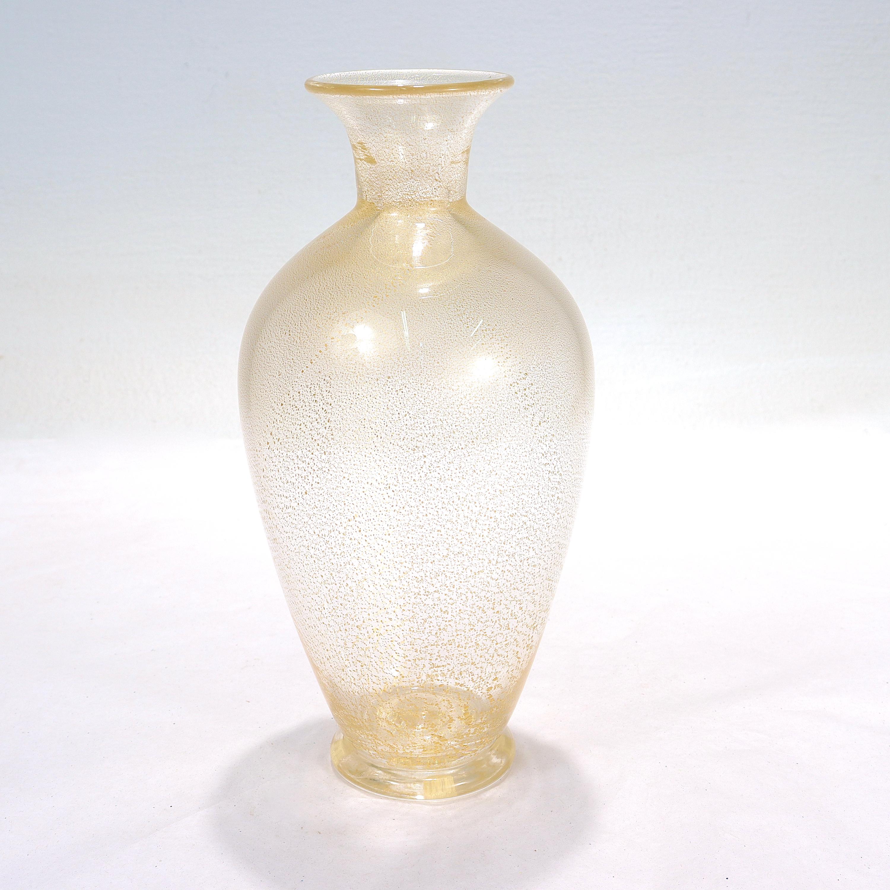 A fine Italian art glass vase.

By Archimede Seguso.

With gold fleck or foil inclusions throughout.

Signed with an etched signature to the base: Archimede Seguso Murano

Simply a wonderful vase from one of Italy's art glass