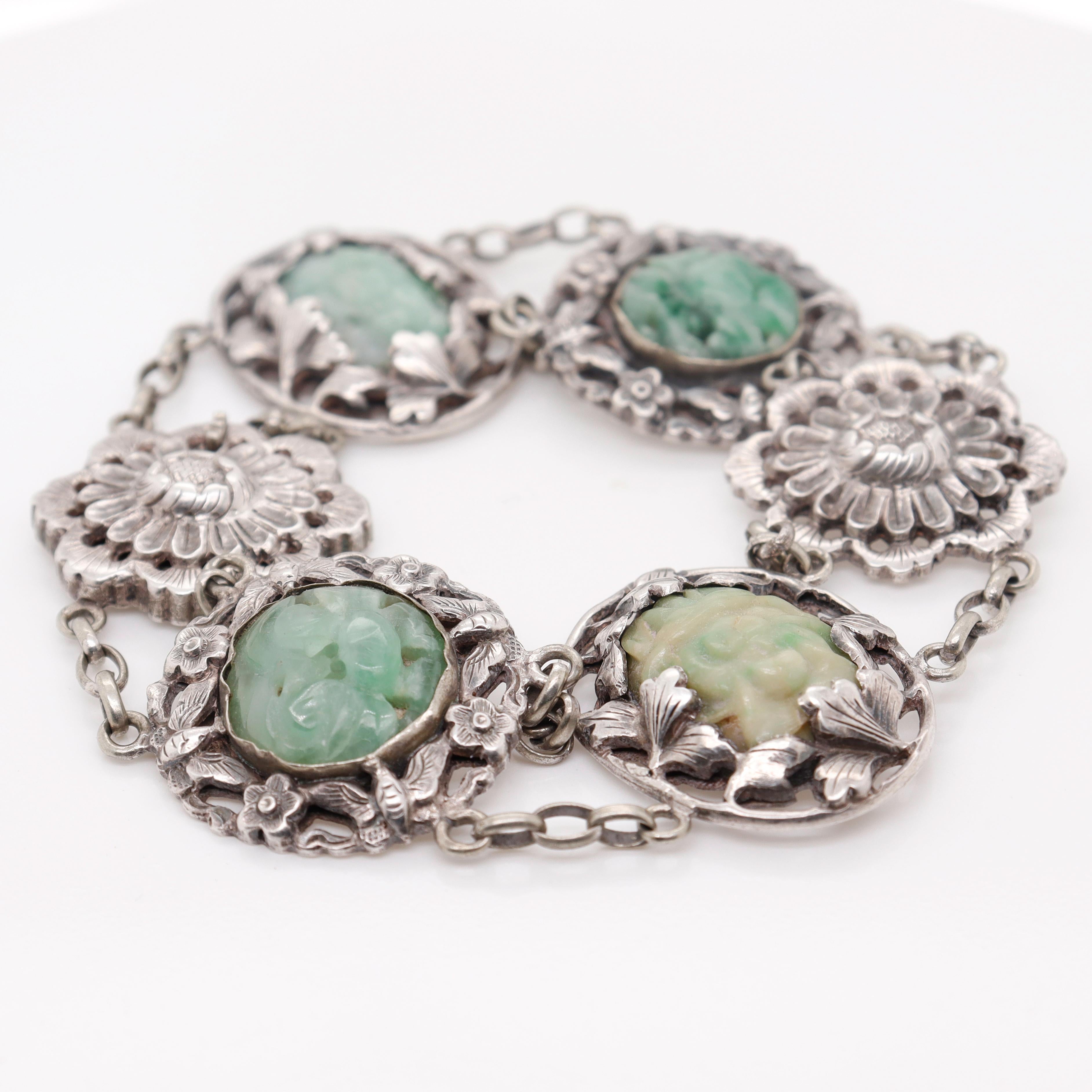 A fine signed Chinese bracelet.

Consisting of 6 silver medallions linked by oval cable chain links. 

Four Medallions have small carved jadeite plaques.

Marked to the reverse with characters.

Simply a wonderful piece of Chinese