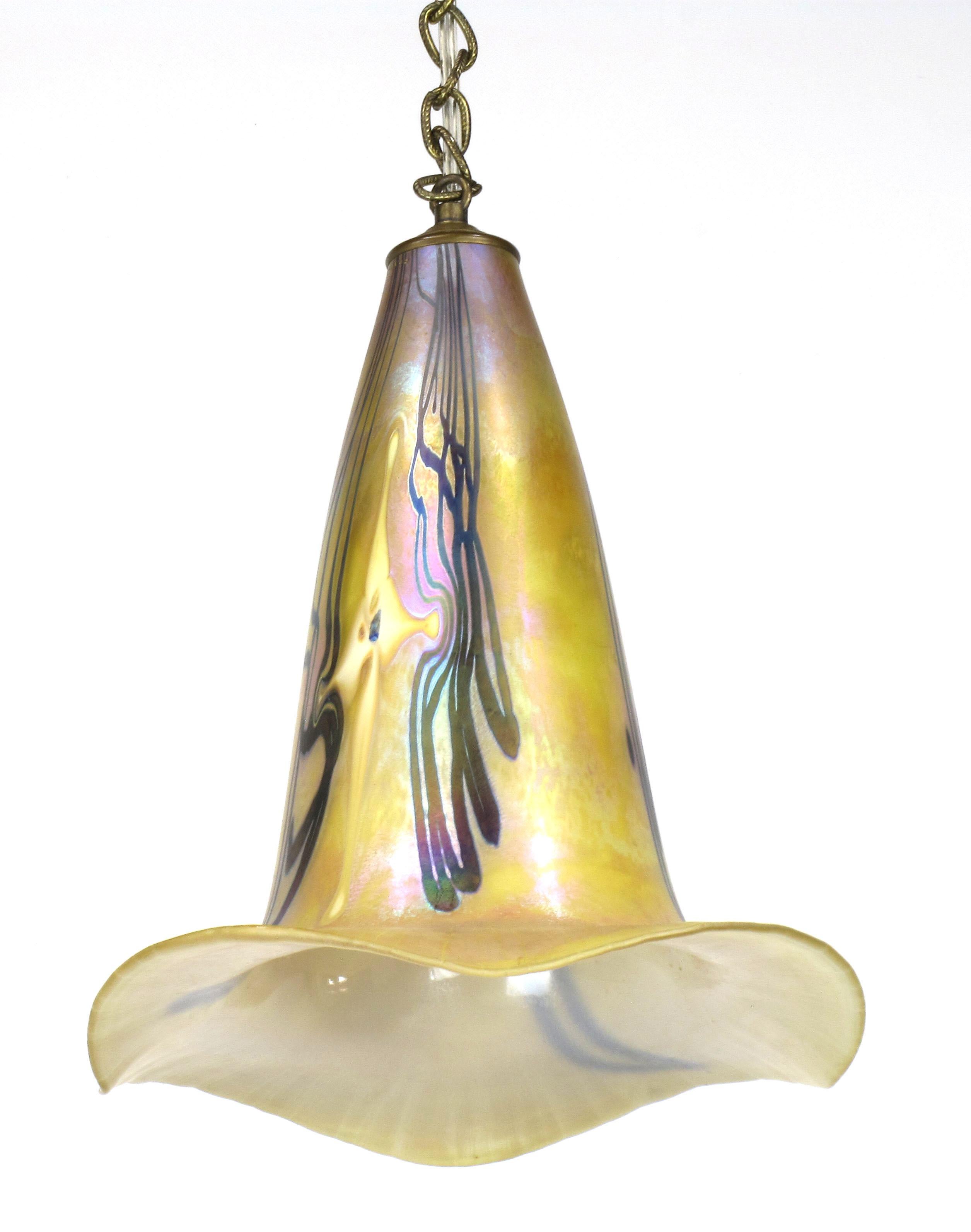 Delicate and colorful iridescent art glass pendant light. Luminous colors of ochre, lavender, violet and turquoise seem to change when seen from different angles. Comes with ample chain, that can be shortened if need be, and canopy. Singed around