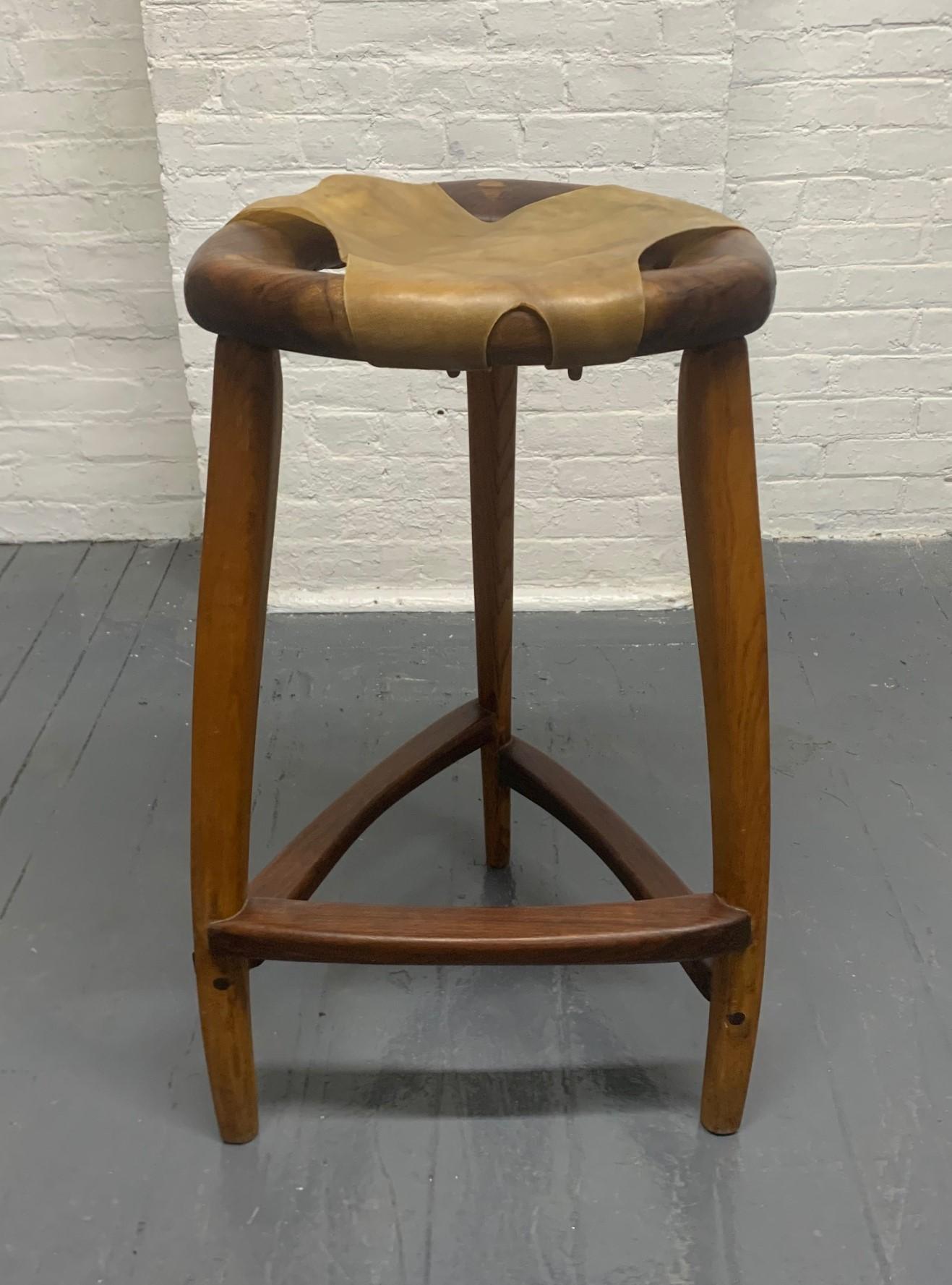 Signed, Arthur Espenet carpenter (American, 1920-2006)
Rare, Rawhide stool, circa 1972. Rawhide stool was made through a process known as bent lamination,” in which the seat frame and legs were built up of several pieces of wood glued together and