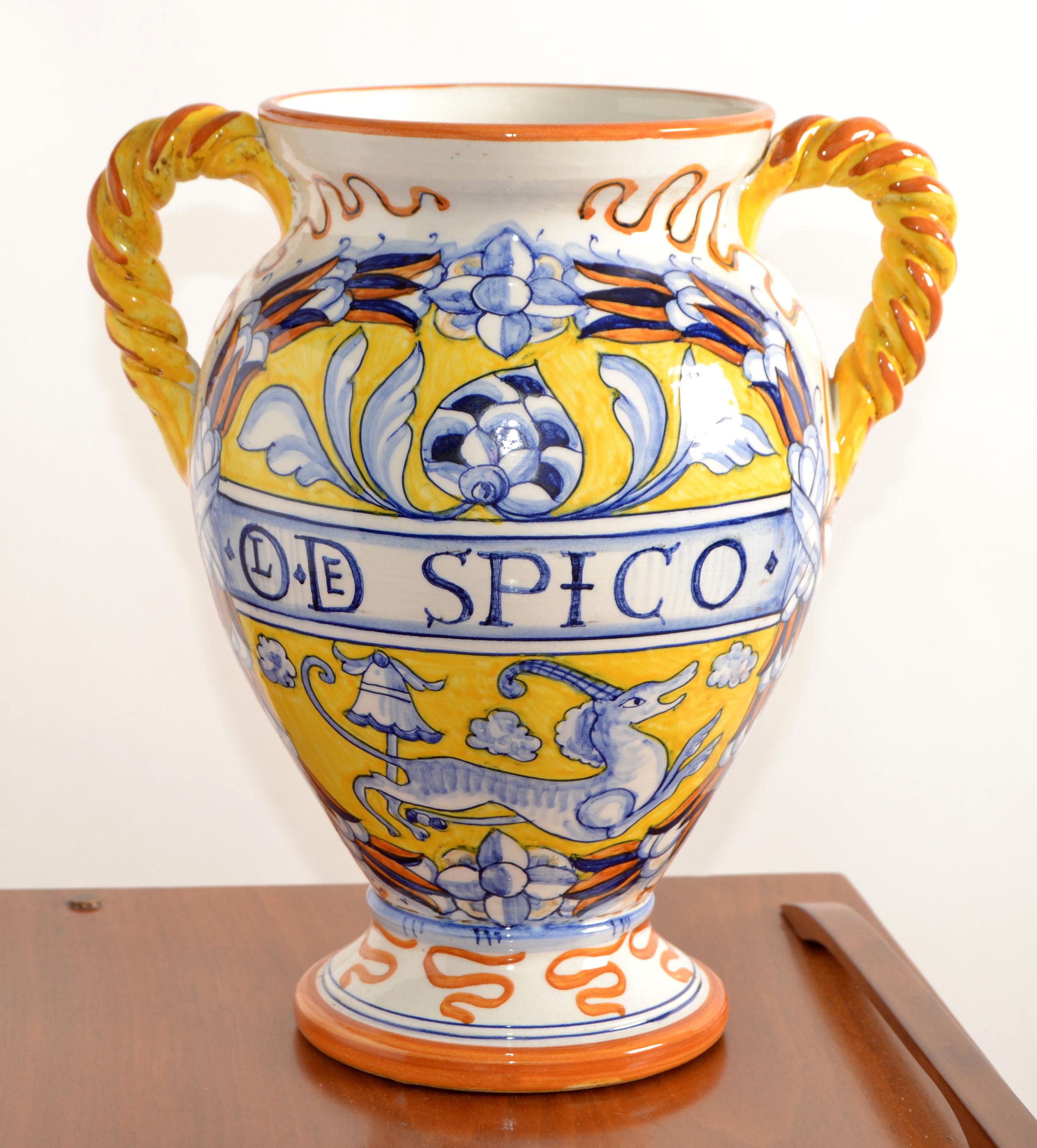 Italian handcrafted and hand painted Deruta Style Ceramic Vase with braided Handles in a honey-gold, beige, yellow and blue Animal motif.
The outside and inside is glazed.
Stamped Made In Italy, Artistica at the Base.
In good vintage condition, no