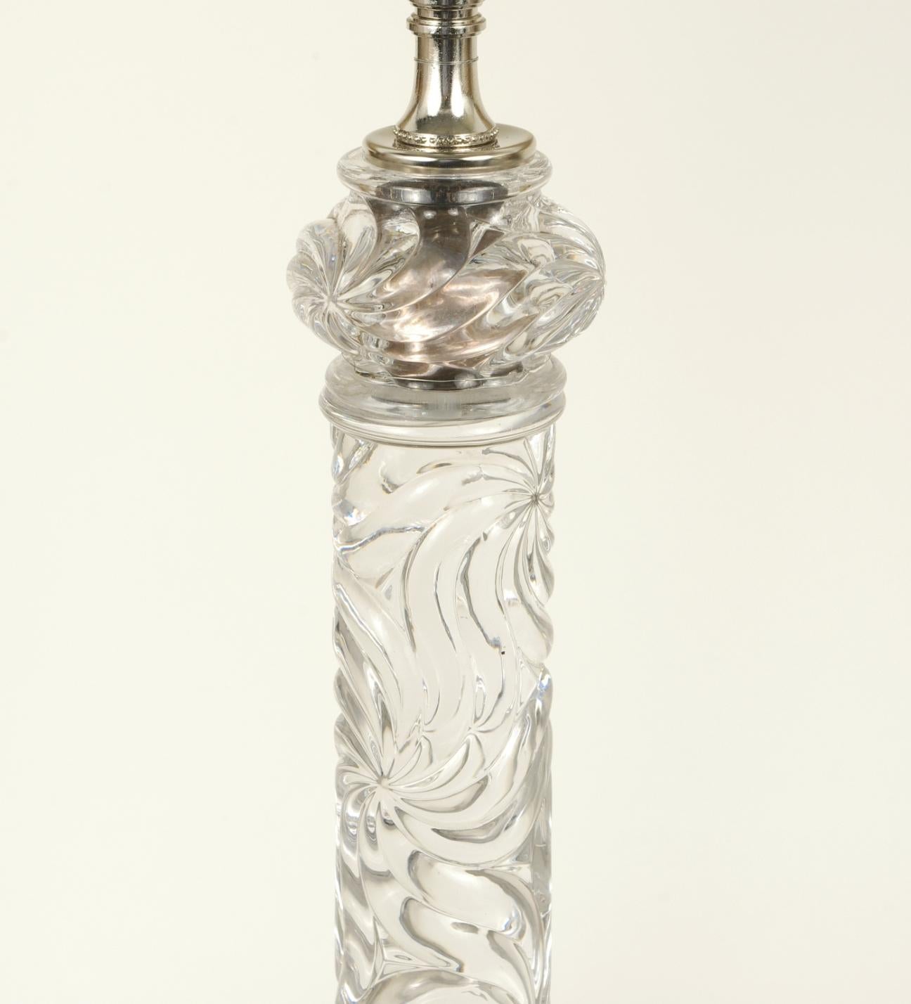 Baccarat crystal lamp, each of the four parts molded with an overall swirl pattern, now French wired. 

Molded 