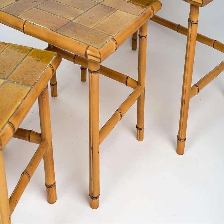 Beautifully crafted set of three bamboo tables by Bergon, Anduze France. The Bergon signature is present on the back of the tops. Original ceramic tiles in excellent vintage condition. Rare item.
Dimensions indicated are for the tallest table. The