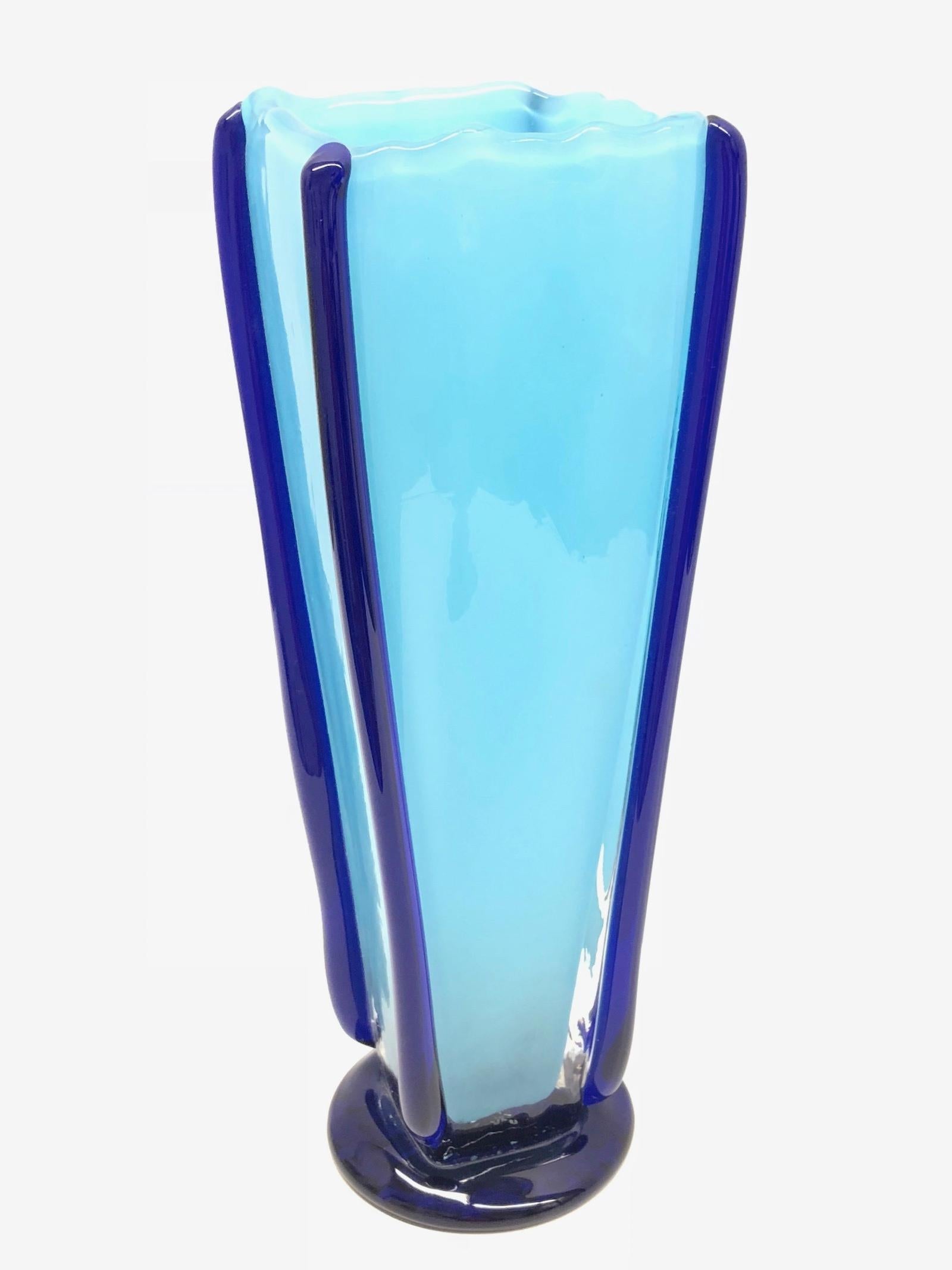 A gorgeous Bohemian glass vase by Jiri Suhajek Design. Made in two different shades of blue. Signed at the base. With minor signs of wear as expected with age and use. Made in the 1970s-1980s.