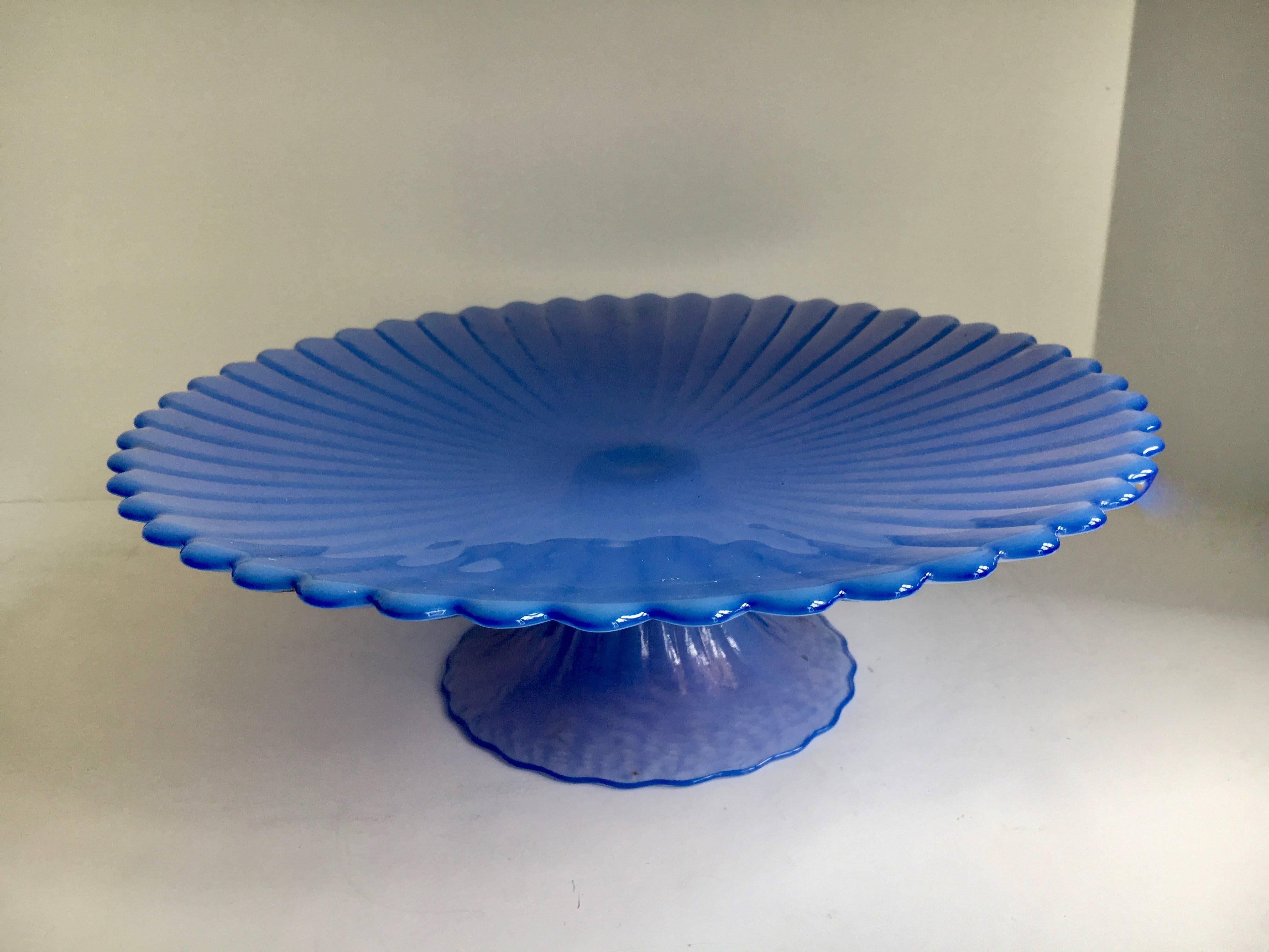 Signed blue Murano cake pedestal plate - a unique and stunning blue color, signed Murano on bottom - great for cakes or desserts.

The base and serving surround are scored as a lovely detail in the brilliant blue glass.