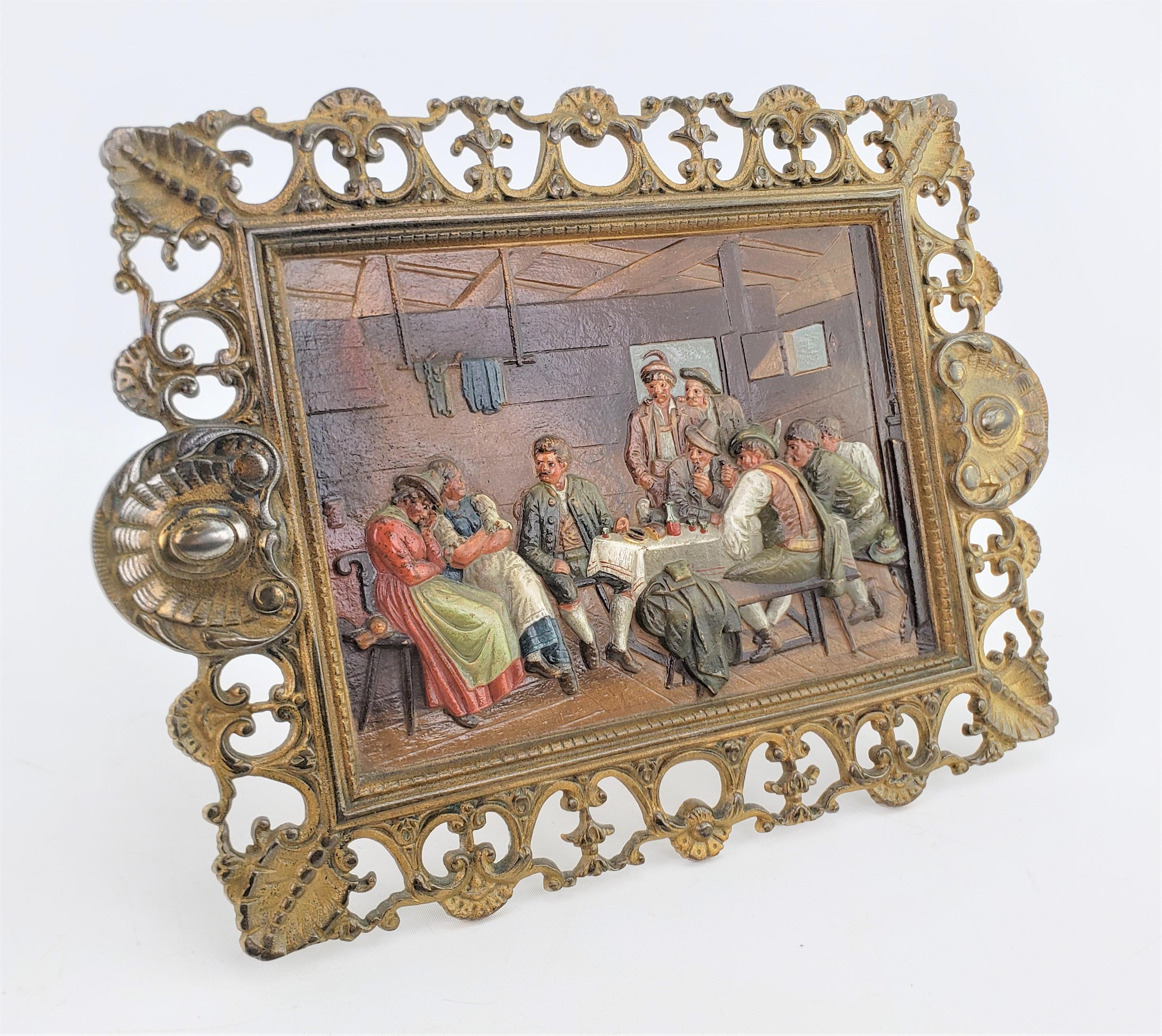 This antique cast and cold-painted metal plaque was done by the renowned Bradley & Hubbard of the United States in approximately 1920 in an American Colonial style. The plaque is done in a cast metal with a very elaborate frame which has been given