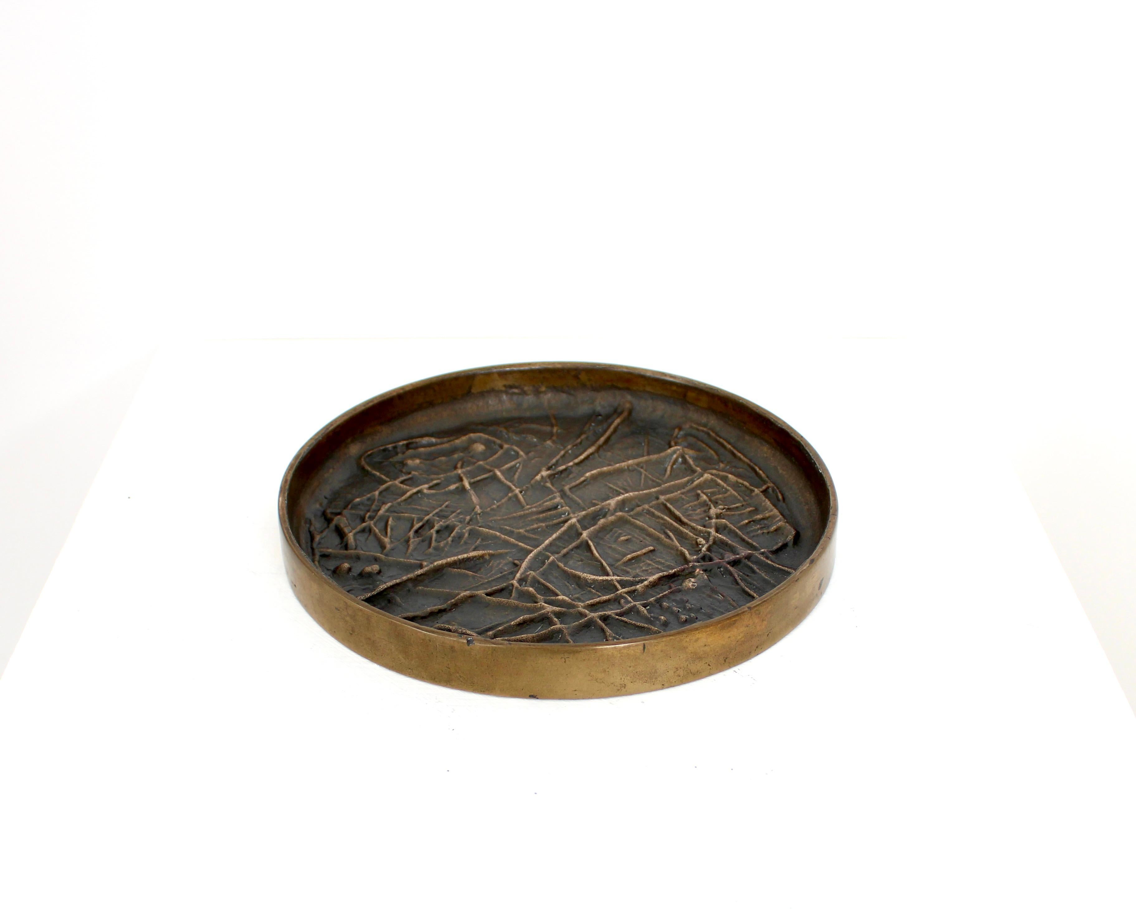 A bronze sculpture / dish by Italian artist Gio Pomodoro for Il Sestante Galleria, Milan, Italy, circa 1958. This example is much larger than the usually found sculptural dishes. The patina is from time and could be more highly polished. 
In the