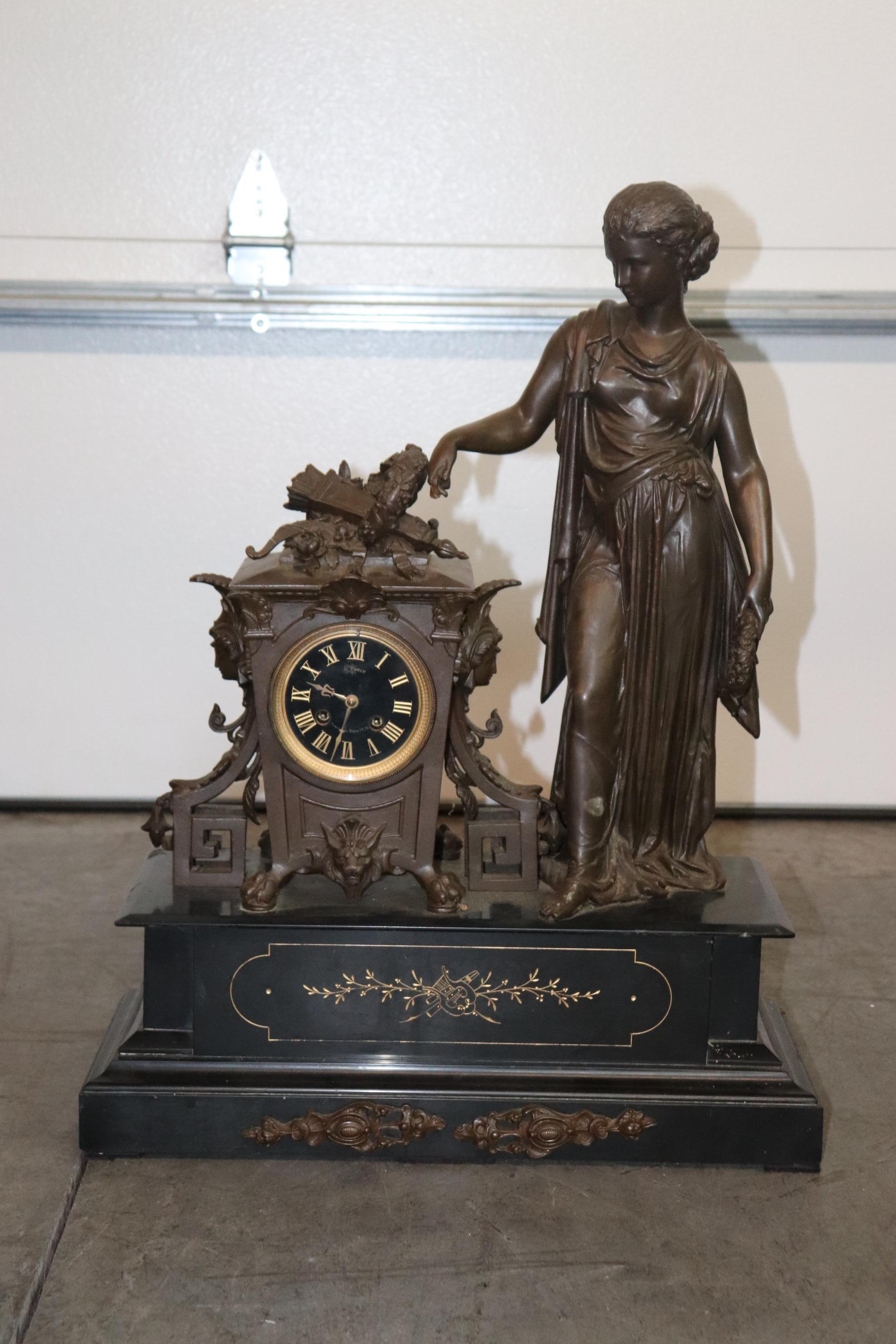 This is a superbly cast figural signed A.Petit mantle clock. The figure is expertly cast and looks like something Belluse would;ve done. The patina is beautiful and the closk just has that gravitas that you are searching for when chooing a mantle