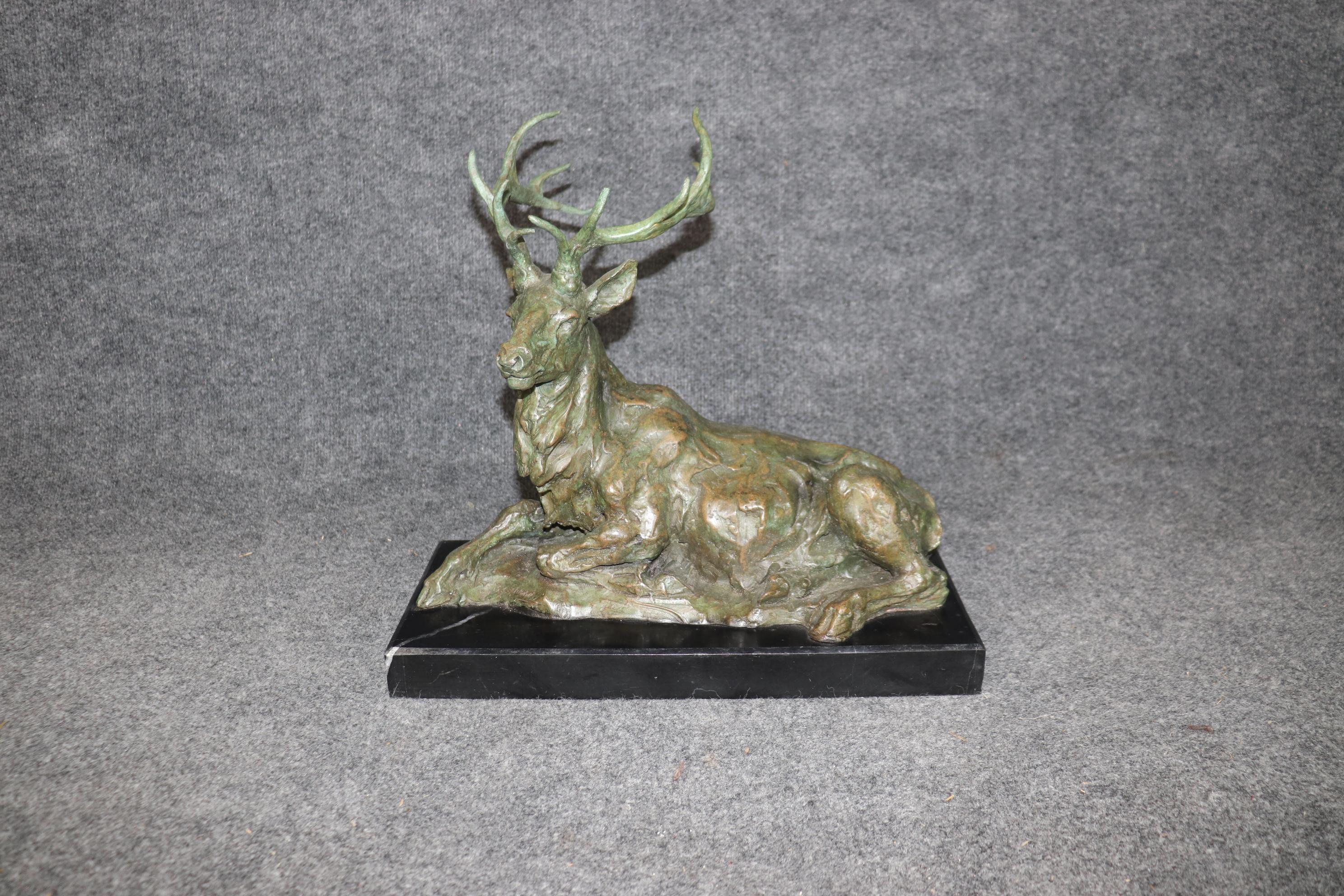 This is a gorgeous signed statue in bronze of a deer with a huge rack of antlers. The deers is signed and done in the manner of Francois Cartier. It is beautifully cast and dates to the end of the last century. The statue is in good condition.