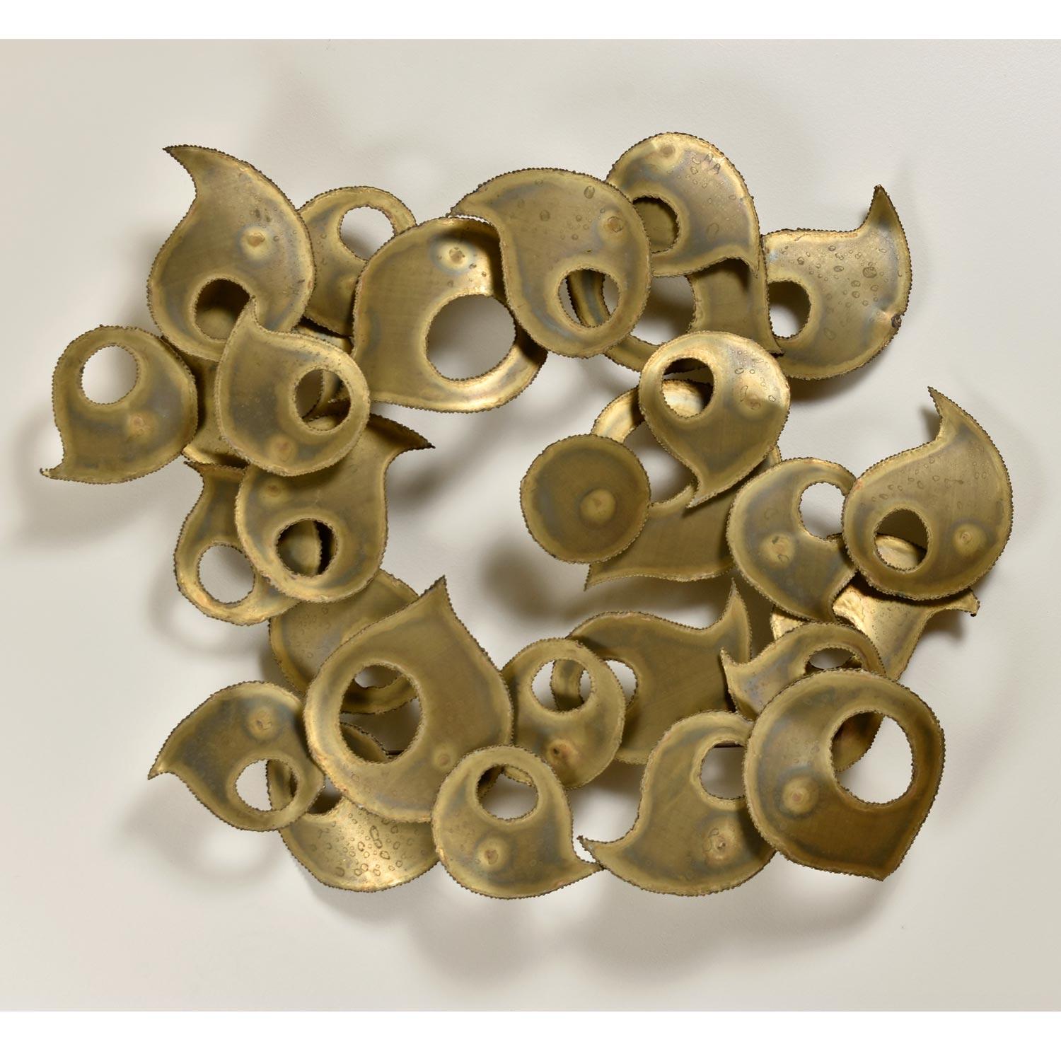 Gaze into the handmade beauty of this metal paisley nebula. This substantial, striking, Mid-Century Modern raindrop wall sculpture is signed 