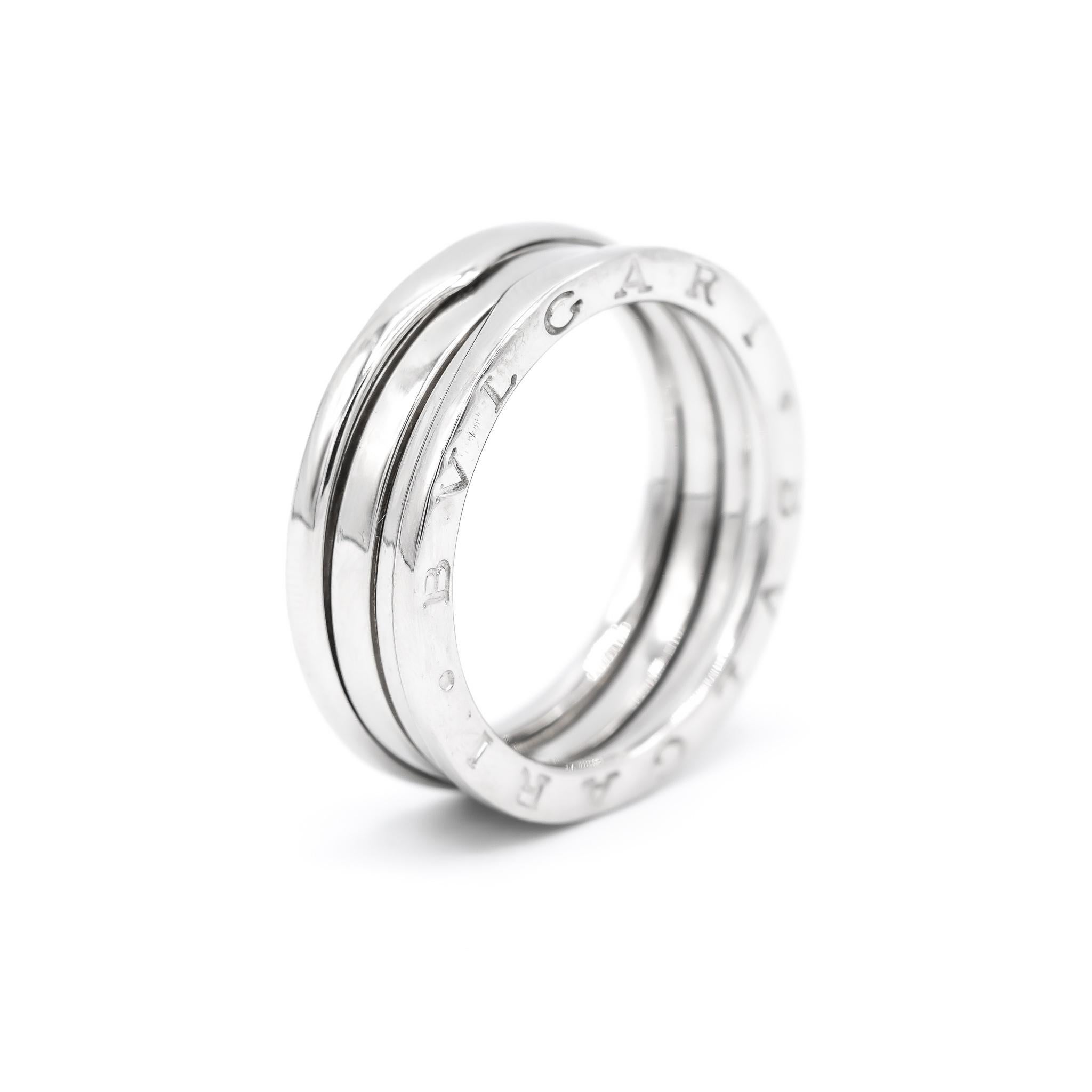 One designer made textured & polished, machine engraved 18K white gold, wedding ring with a comfort-fit shank. The ring is a size 10, is 2.53mm thick and measures approximately 7.53mm in width and weighs a total of 9.80 grams. Engraved with