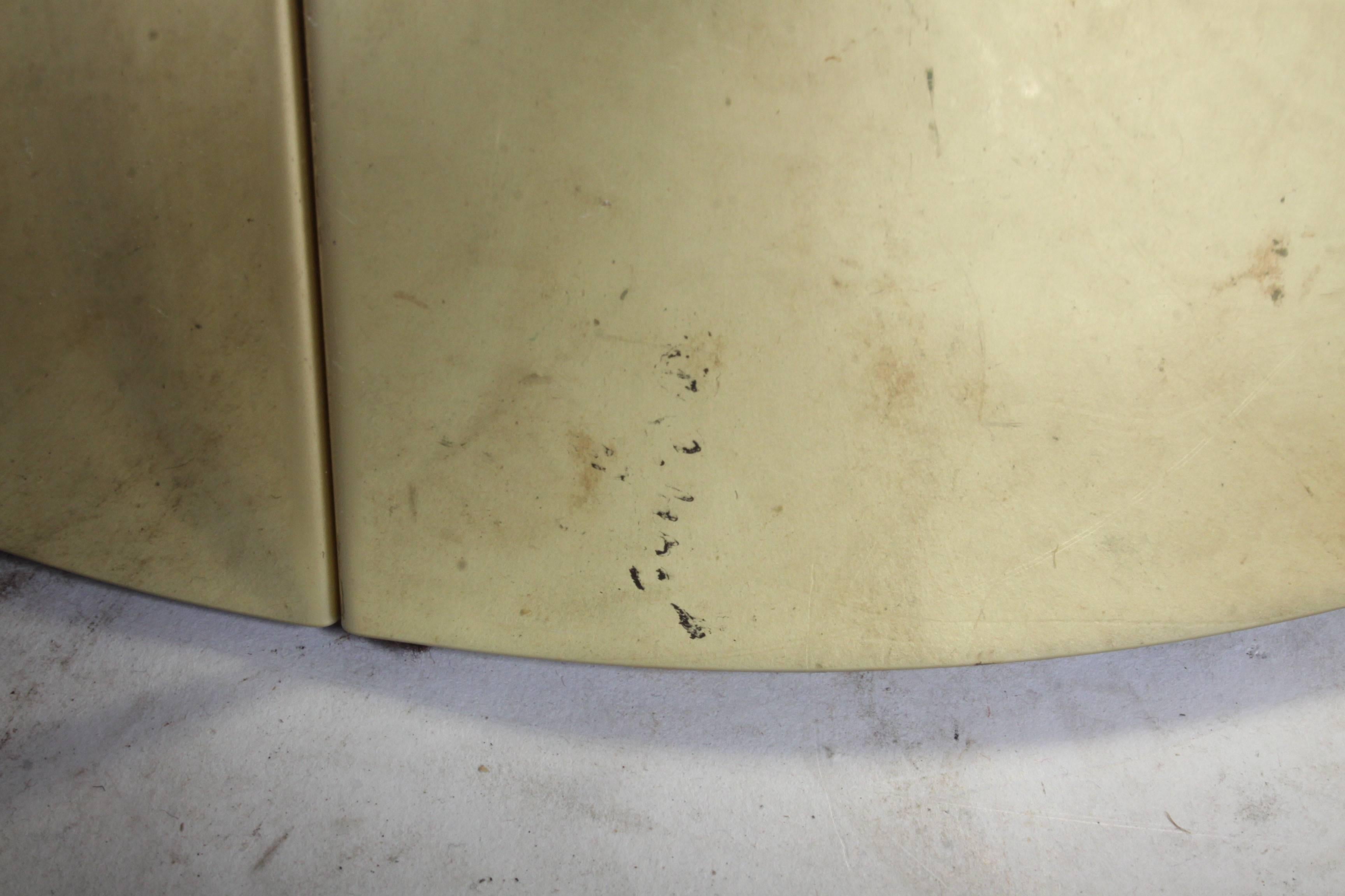 Signed C. Jere brass drum end or side table with slight patina. One minor small indentation at base. Signature is present, but faded. Note brass is reflective, picking up dirt on paper. Vertical seems.