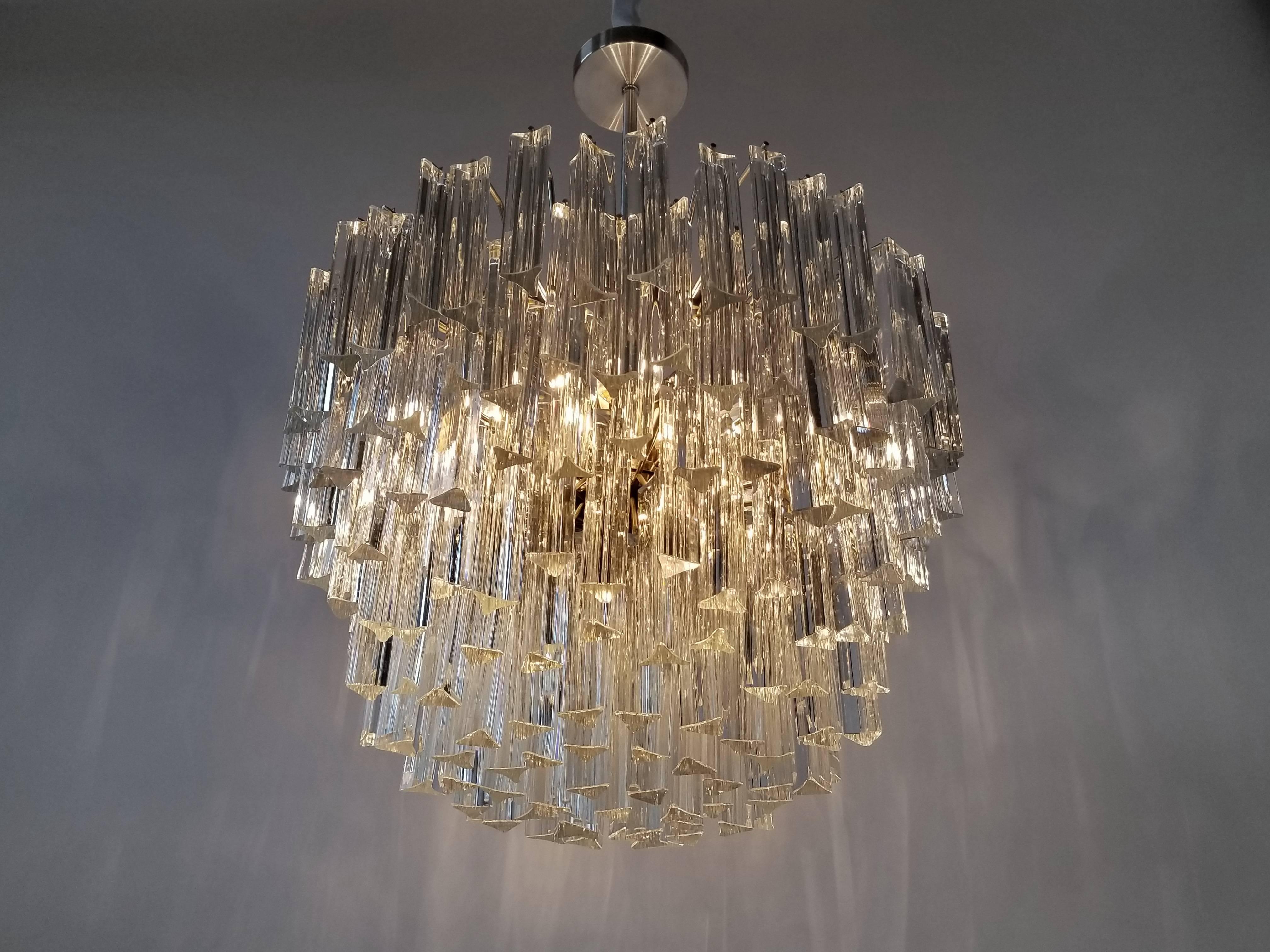 Massive Camer/ Venini optical glass quality prism chandelier.

Solid, well made handcrafted steel structure.

8 regular E26 size ceramic socket rated at 100 watt. 

Total weight of fixture with glass, 110 pounds / 50 kilos.

 