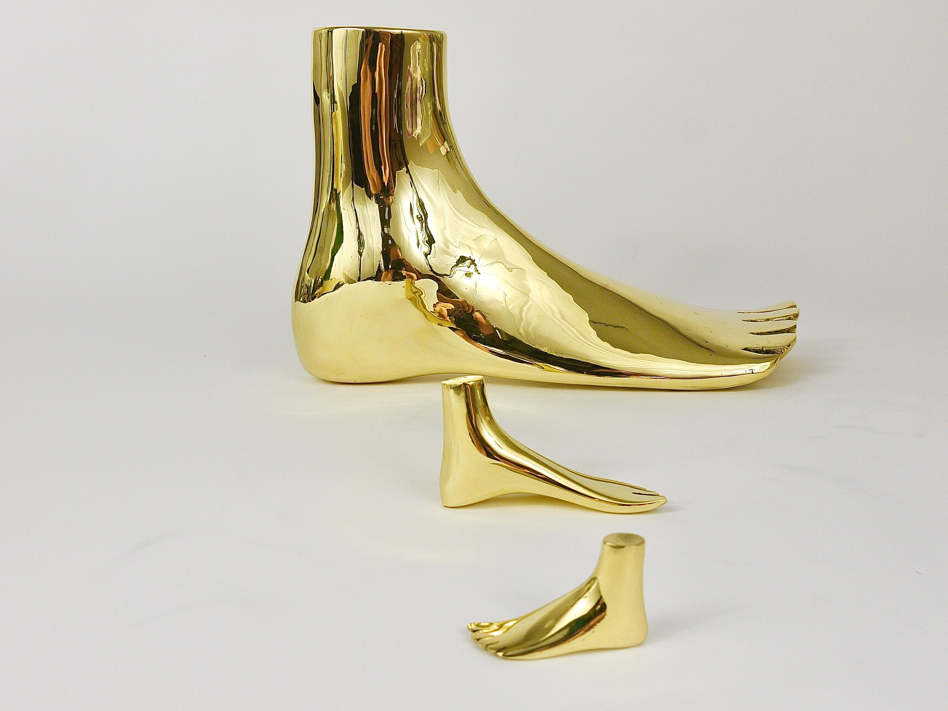 A charming modernist paperweight in the shape of a foot, designed by Carl Auböck in the 1950s. 
Handmade of solid polished brass by Werkstätte Auböck in Austria. Fully stamped and marked.

This is a handcrafted object; each piece and finish will