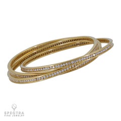 Bracelet trinité en or 18K signé Cartier et orné de diamants