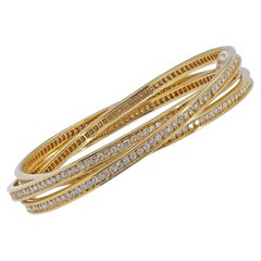 Bracelet trinité en or 18K signé Cartier et orné de diamants
