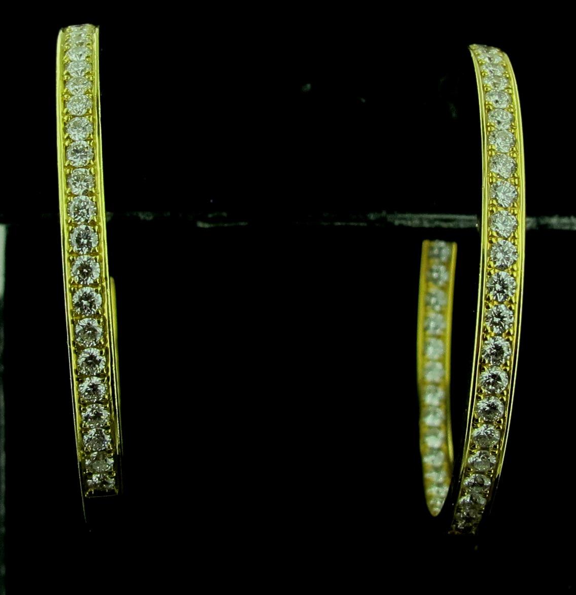 Set in 18 karat yellow gold are 90 round brilliant diamonds, with a total diamond weight of 1.80 carats, in 