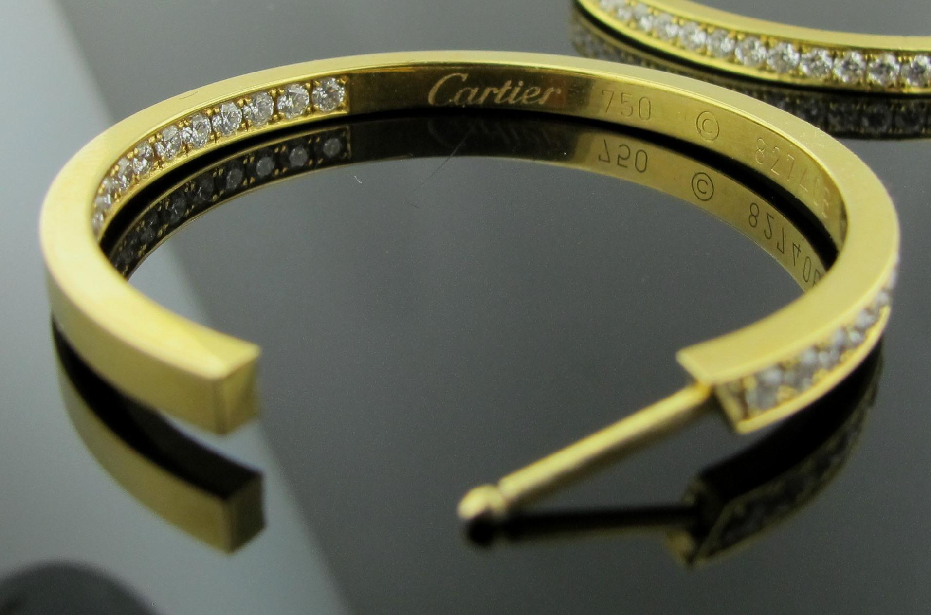 Signed Cartier Inside Out Diamond Hoop Earrings in 18 Karat Yellow Gold In Excellent Condition In Palm Desert, CA
