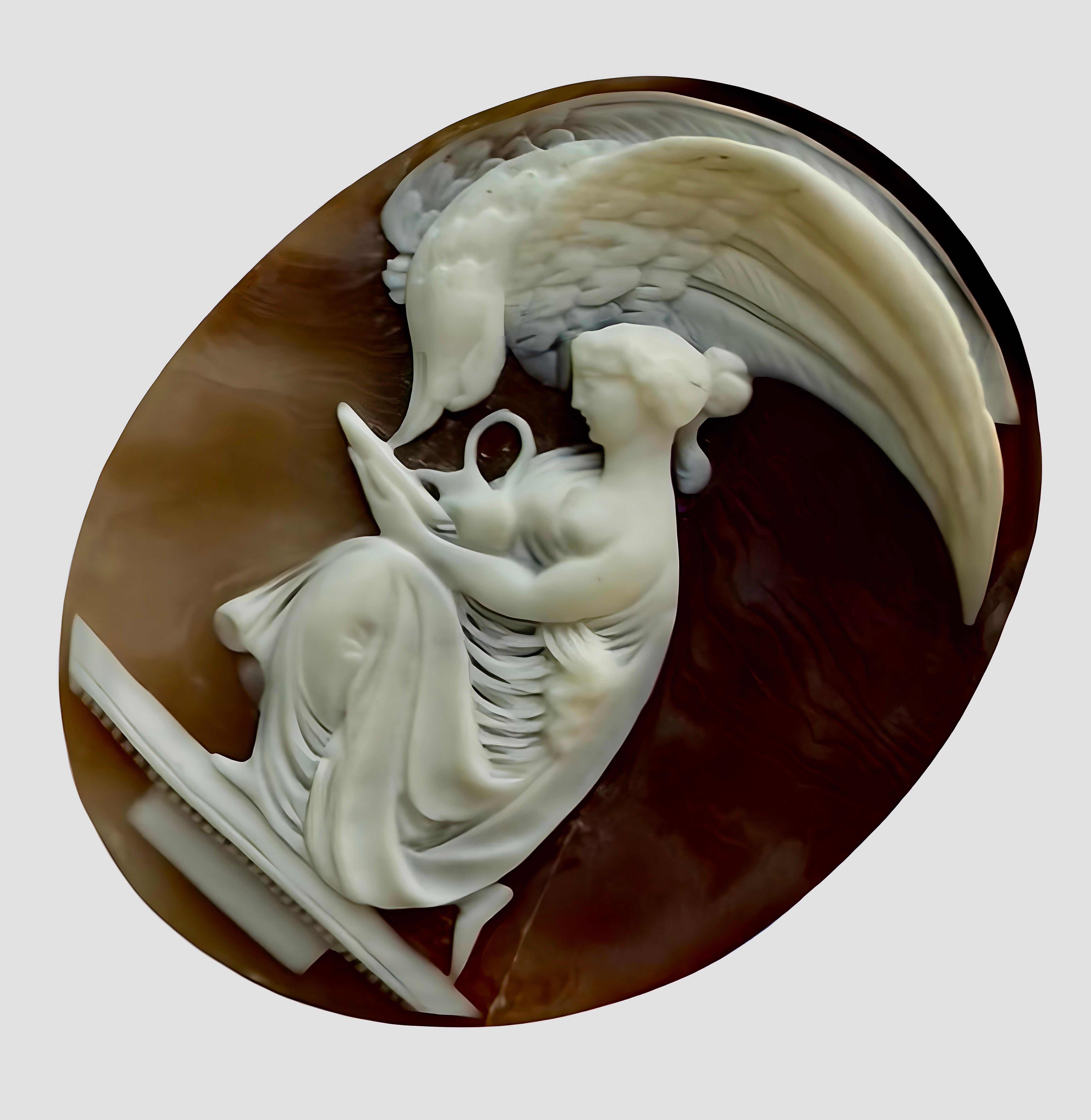 Superbe camée ancien signé par Ch. Schmoll représentant la déesse grecque Hébé et Zeus en aigle. Cette pièce particulière date d'environ 1880.
L'image montre un camée représentant Hébé, la déesse grecque de la jeunesse, donnant de l'ambroisie à