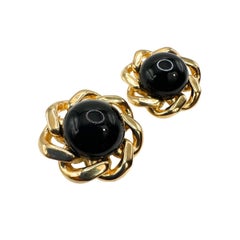 Signed Ciner Black Cabochon Glass Floral Clip on Earring