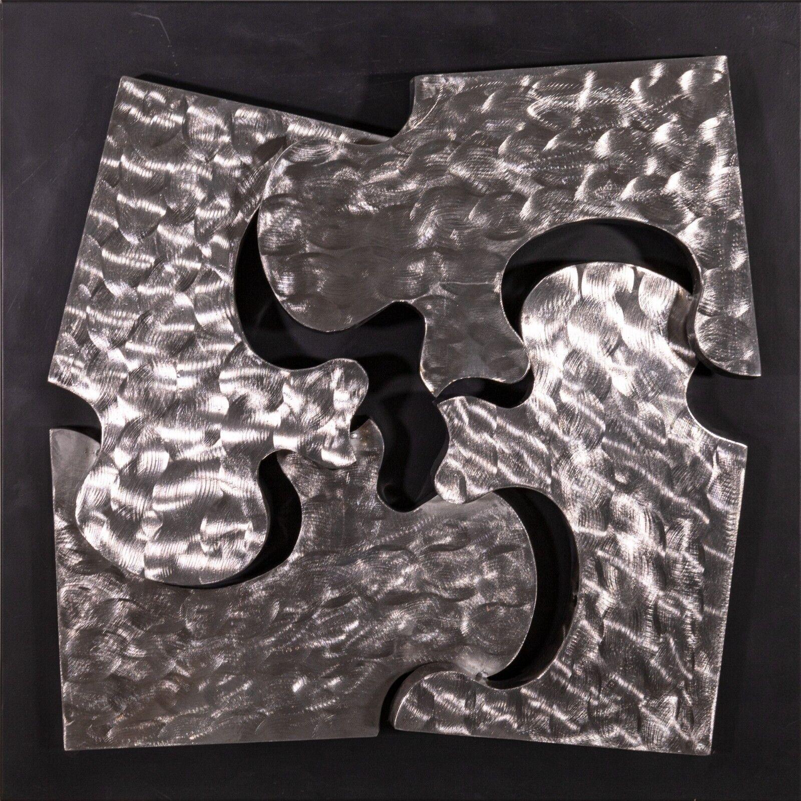 Signed Curtis Jere 1999 pair of puzzle piece brushed metal wall sculptures. 
