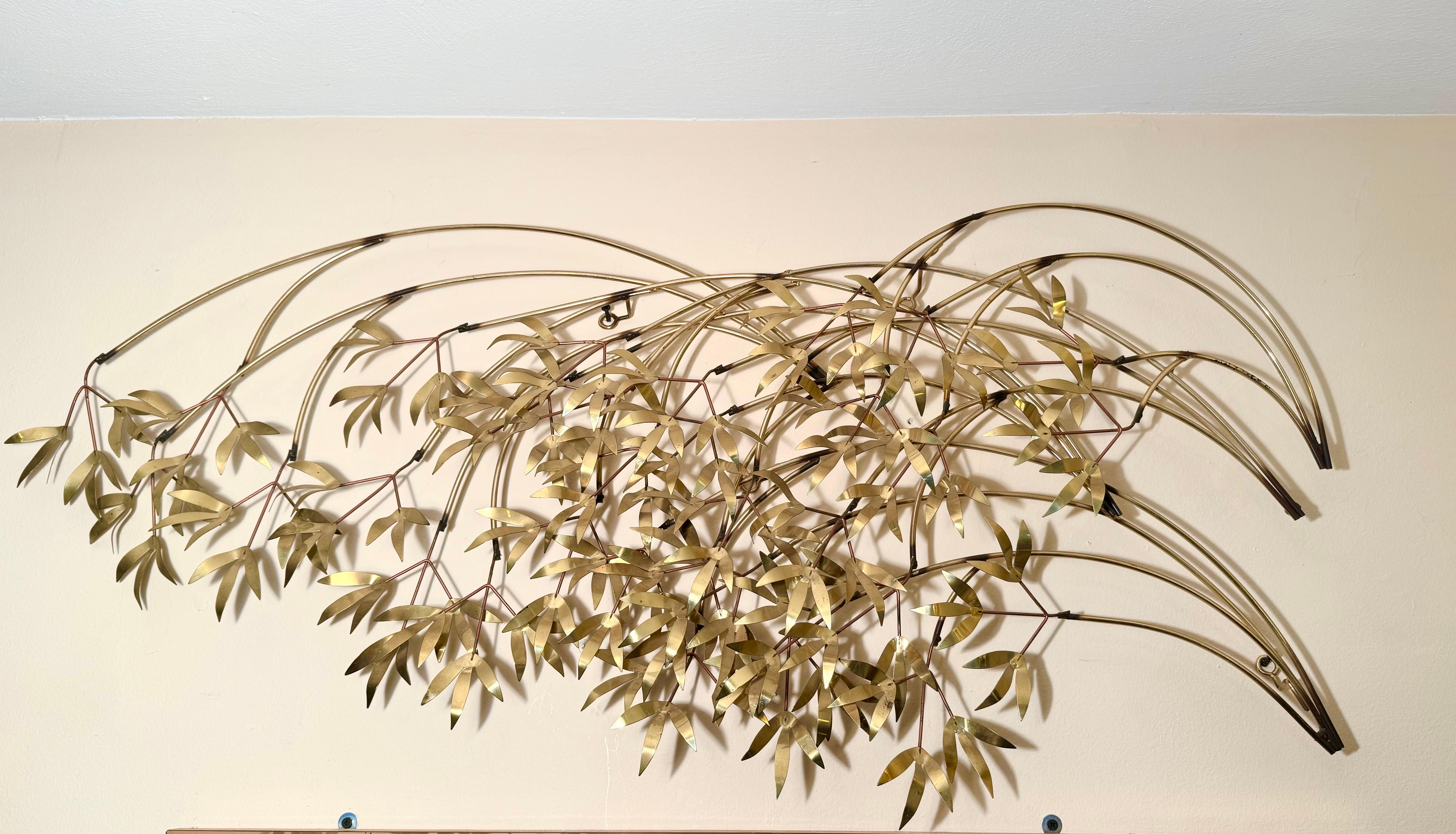 Signed Curtis Jere Metal Wall Sculpture. Windswept spray of tree branches in a bright brass design. Perfect accent wall piece for above a bed or a sofa. 