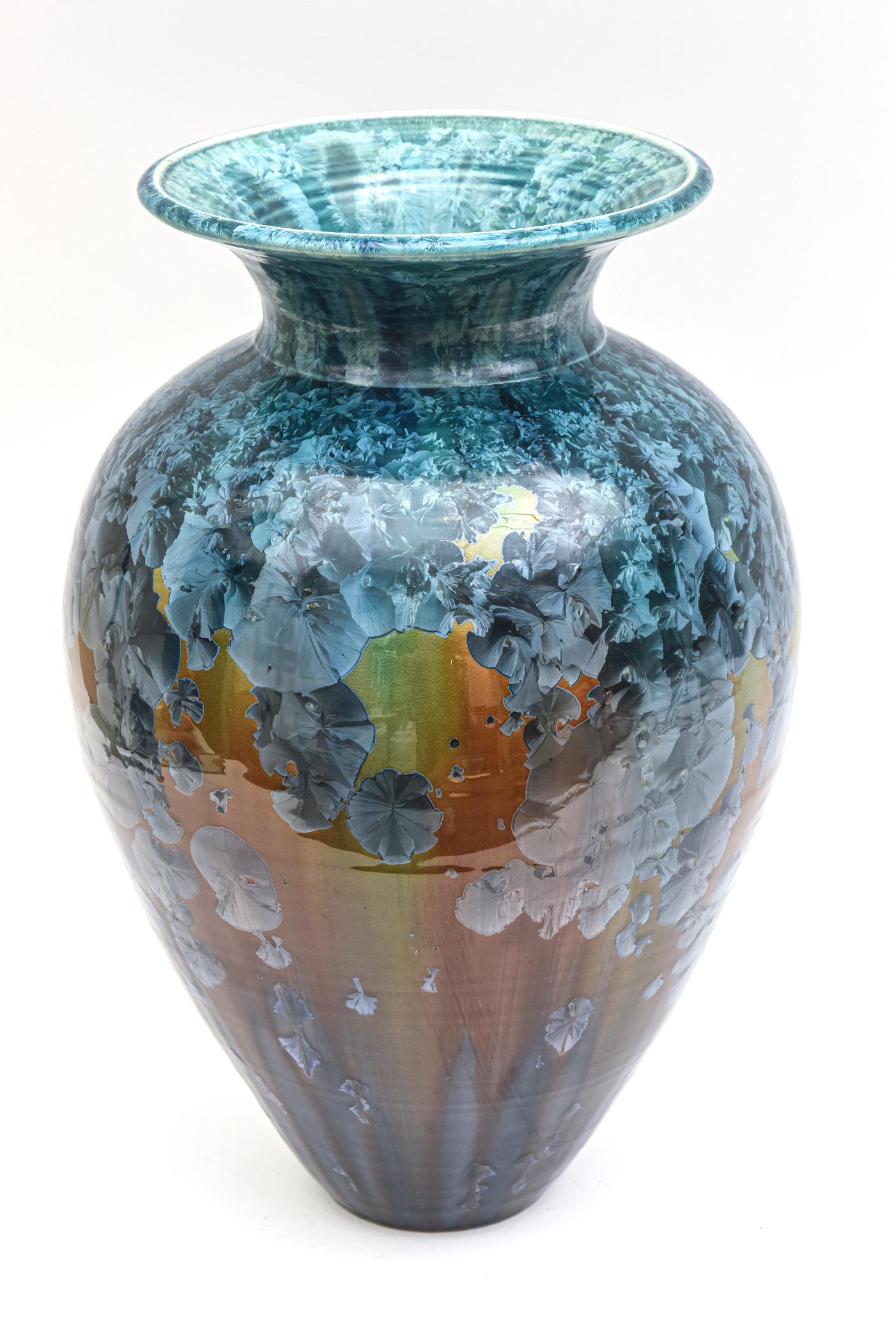 This lovely arresting signed and dated glazed large ceramic vase, vessel or object is with a crystalline glaze. It is signed Phil Morgan and dated 1995. The colors are shades of different blues, aqua teal amber brown, used to form an abstract