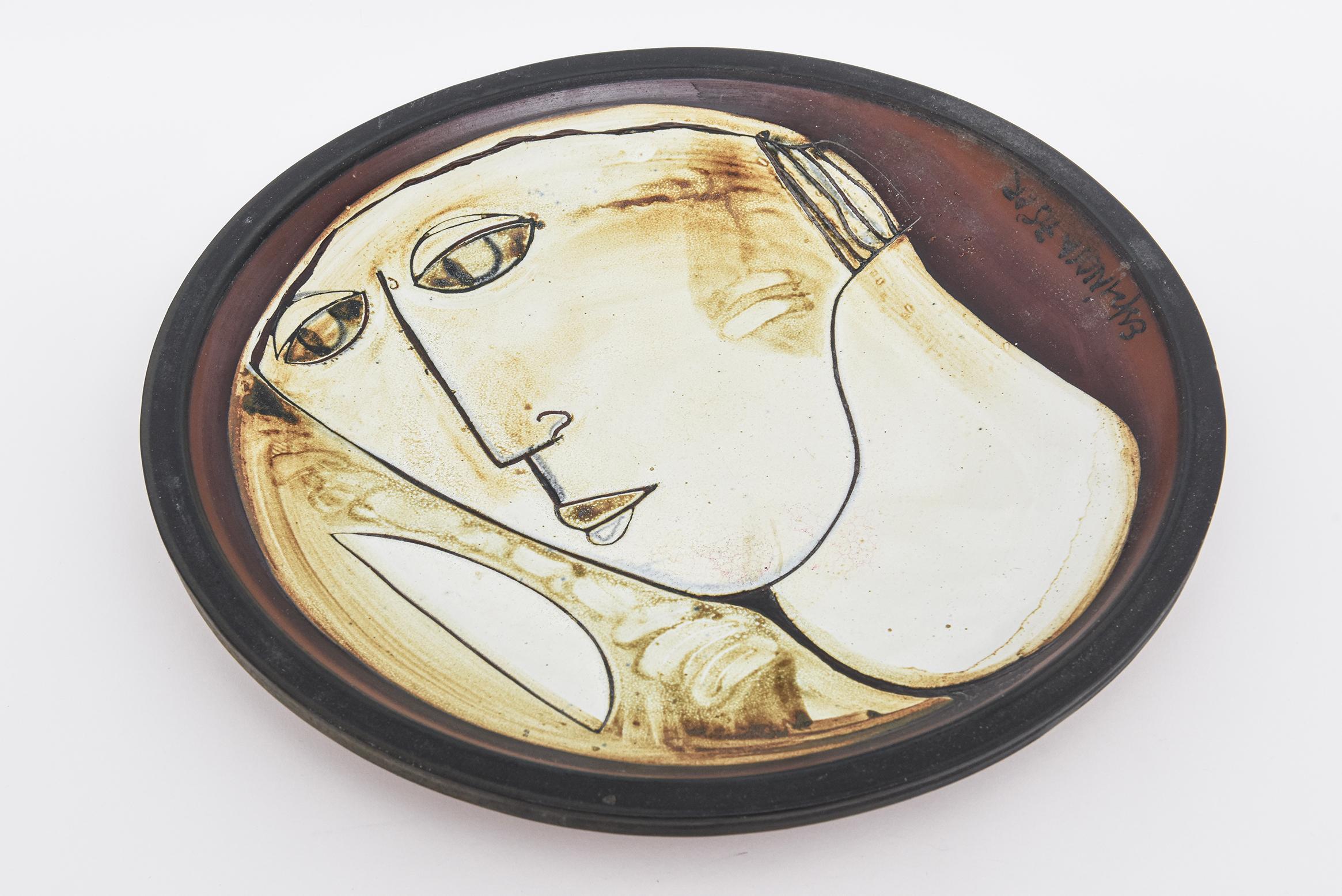 This abstract vintage signed and dated pottery bowl or hanging bowl by Susana Espinosa has a frontal abstract face. She was Argentinian born and migrated to Puerto Rico in the late 60;s. In Argentina she graduated in 1953 from the Academia de Bellas