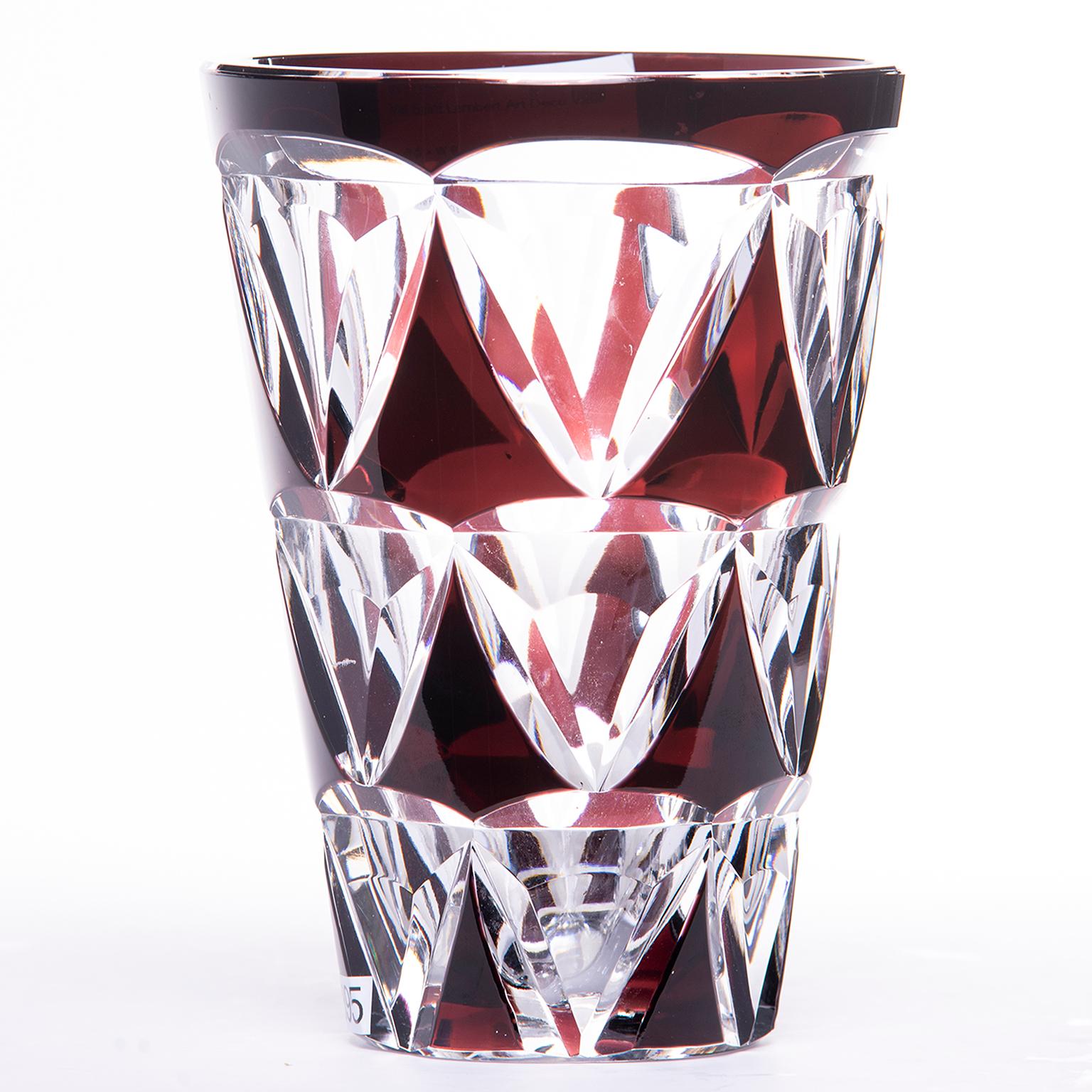 Tall Val St. Lambert vase in heavy clear crystal with deep garnet rim and three rows of faceted graduated size color panels, circa 1930s. Etched Val St. Lambert signature on underside of base. Base diameter is 3.5