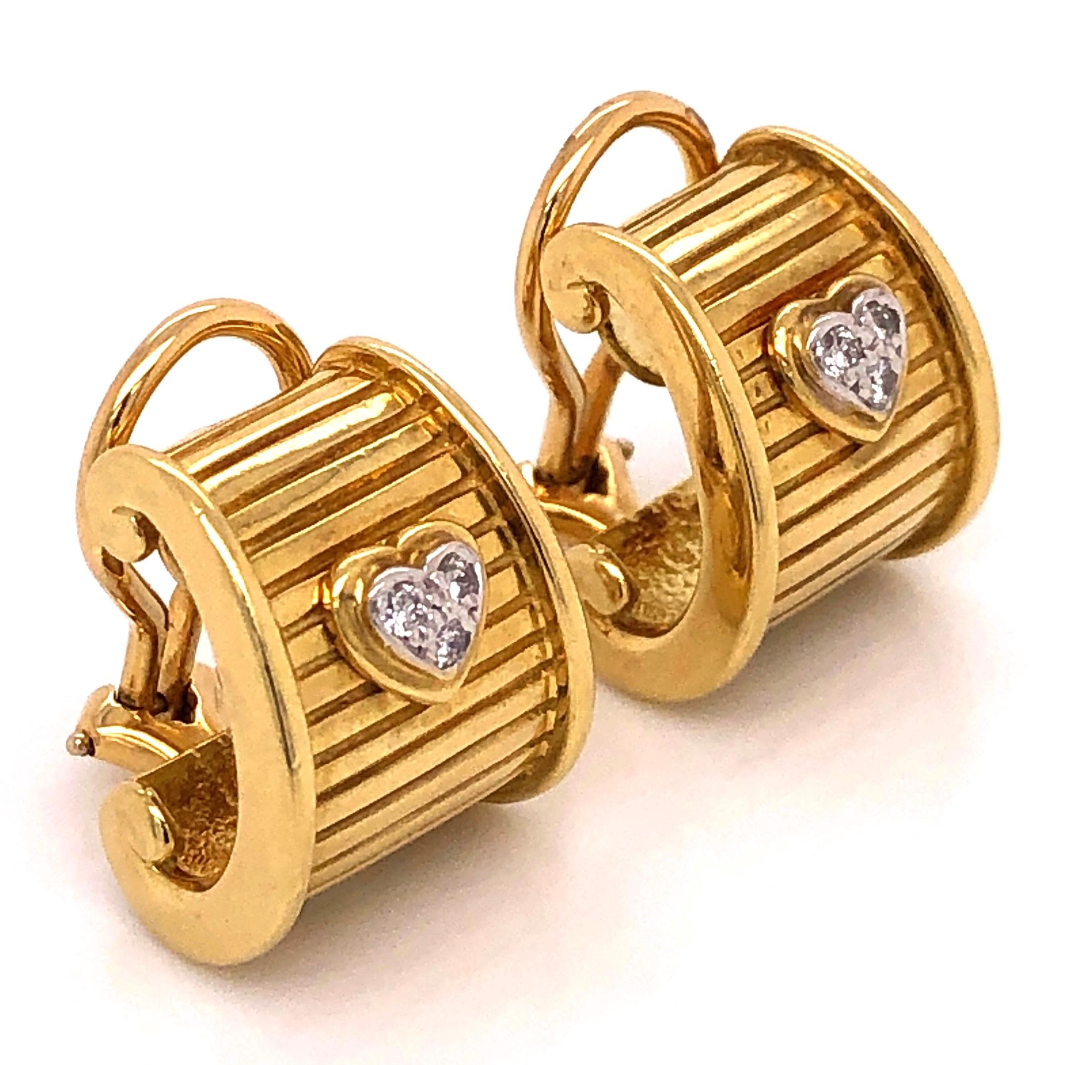 Simply Beautiful! Signed DKW Designer 18 Karat Yellow Gold Earrings. Each set with a Pave Diamond Heart. Approx. 0.12tcw. Hand crafted in 18 Karat Yellow Gold Ribbed design. French Clips; No post system. Measuring approx. 5/8