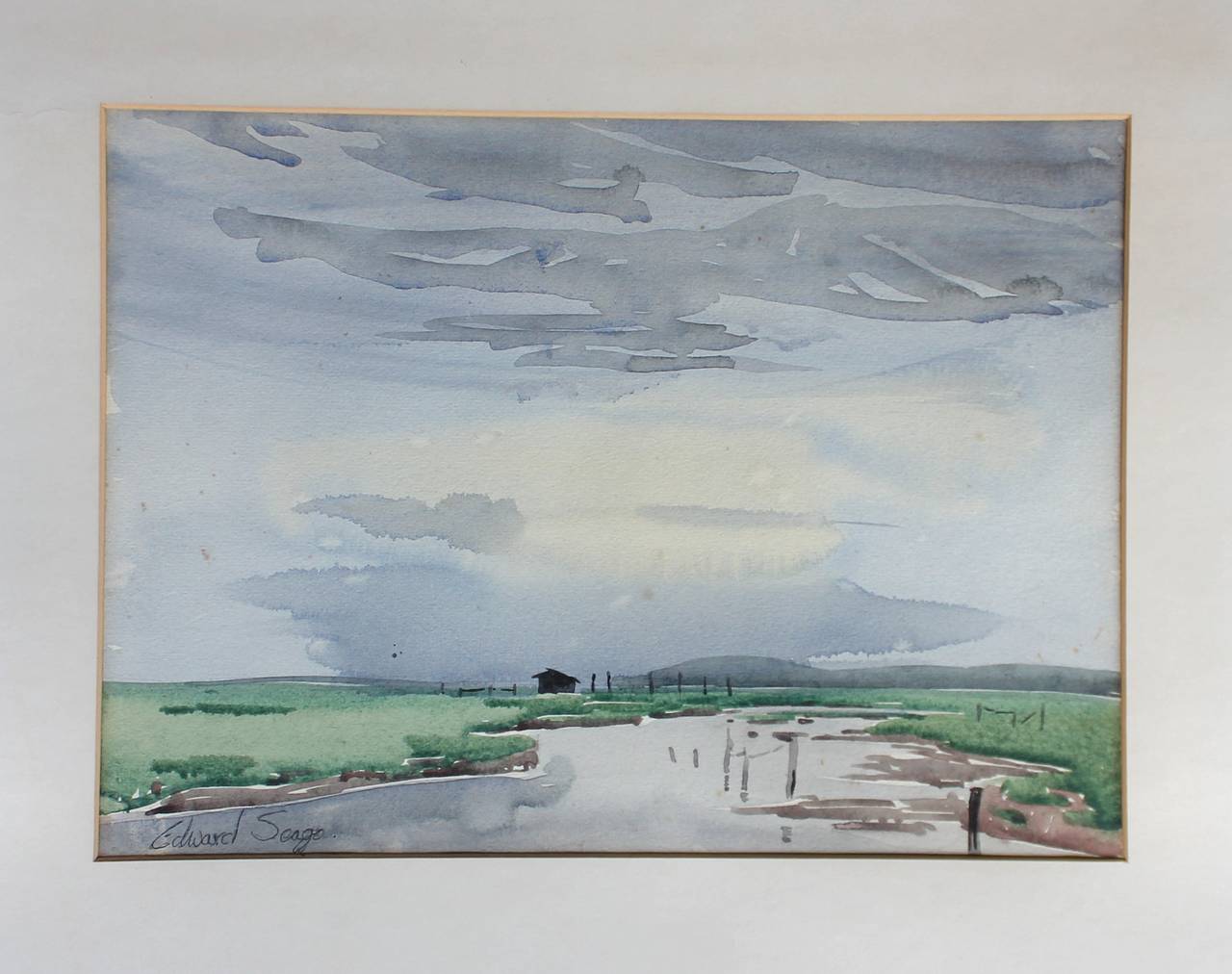 A watercolor by Edward Seago RWS, RBA (1910-1974).

Signed lower left and in its original painted frame. When taking it out of the frame, it has the recipients details in pencil on the reverse of the paper.

Measures: 37cm wide x 27cm high
