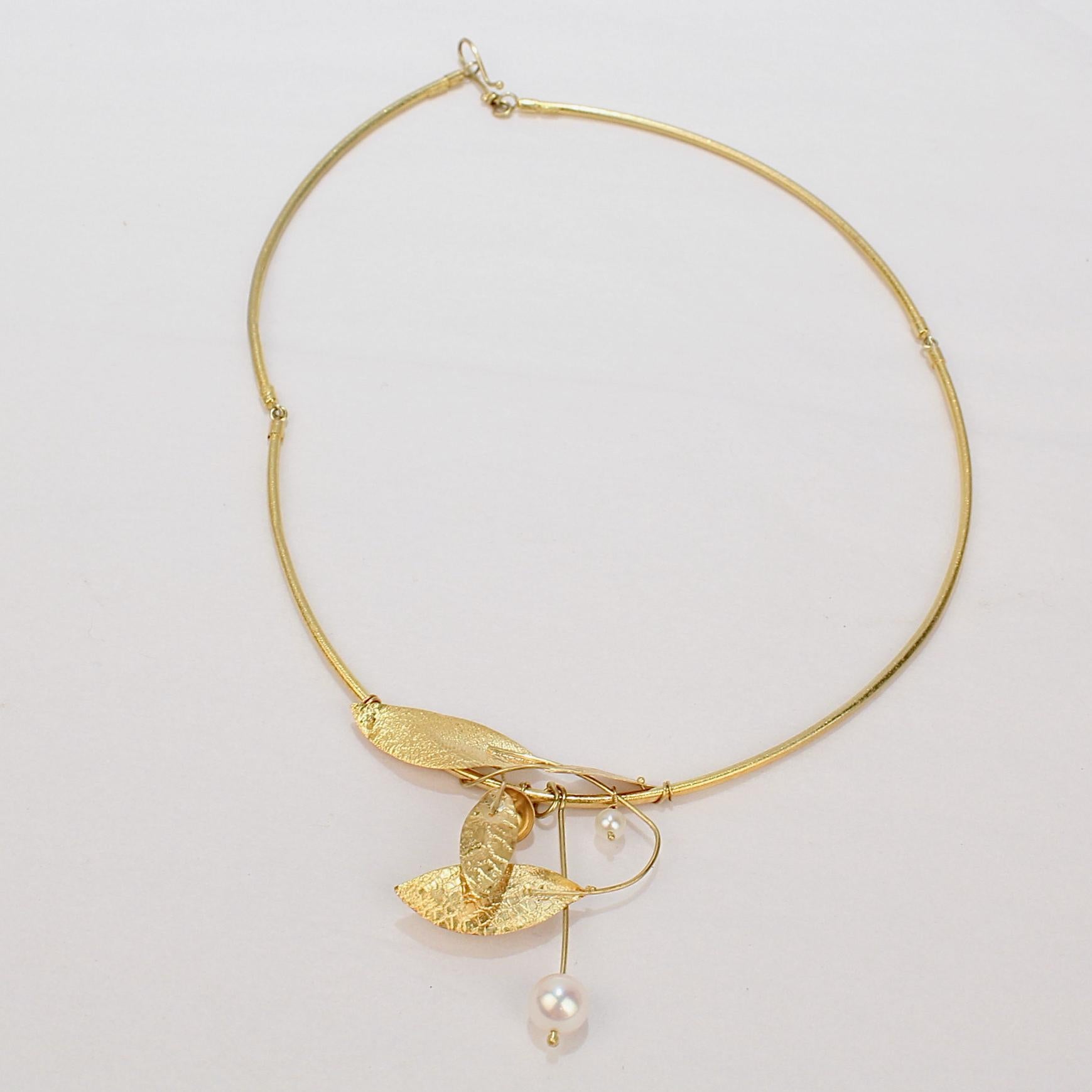 A very fine high karat gold and pearl necklace by Elaf.

This necklace is made of textured leaf shapes overlapping and twisting with pearls suspended on gold wires.  

It is reminiscent of the ancient jewelry of the Mediterranean and evokes notions