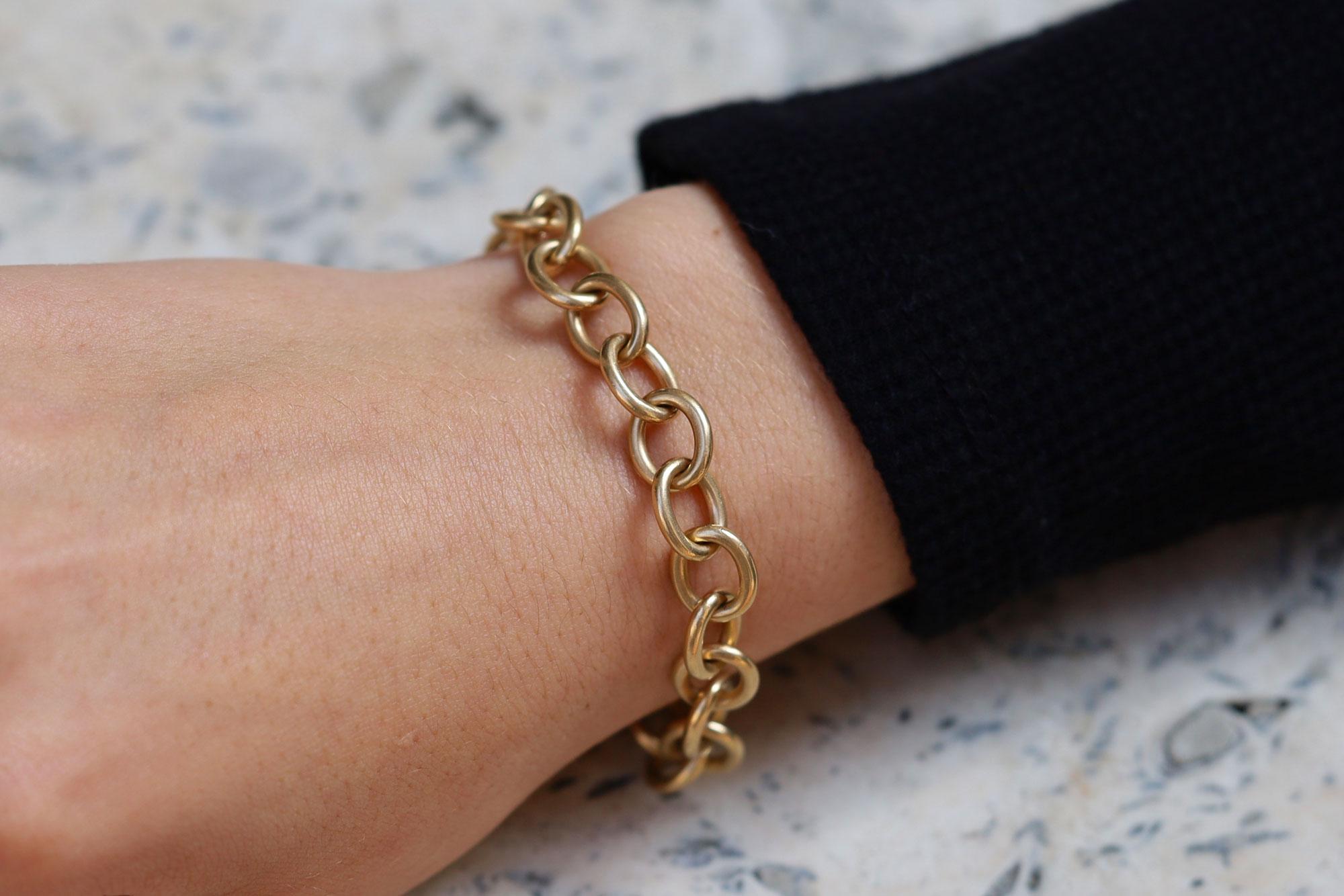 A recent discovery from the estate jewelry collection of a prominent Philadelphia family, this signed Cartier gold link bracelet is a treasured heirloom. The classic rolo links are hand forged of a substantial 25 grams of 14k yellow gold and this
