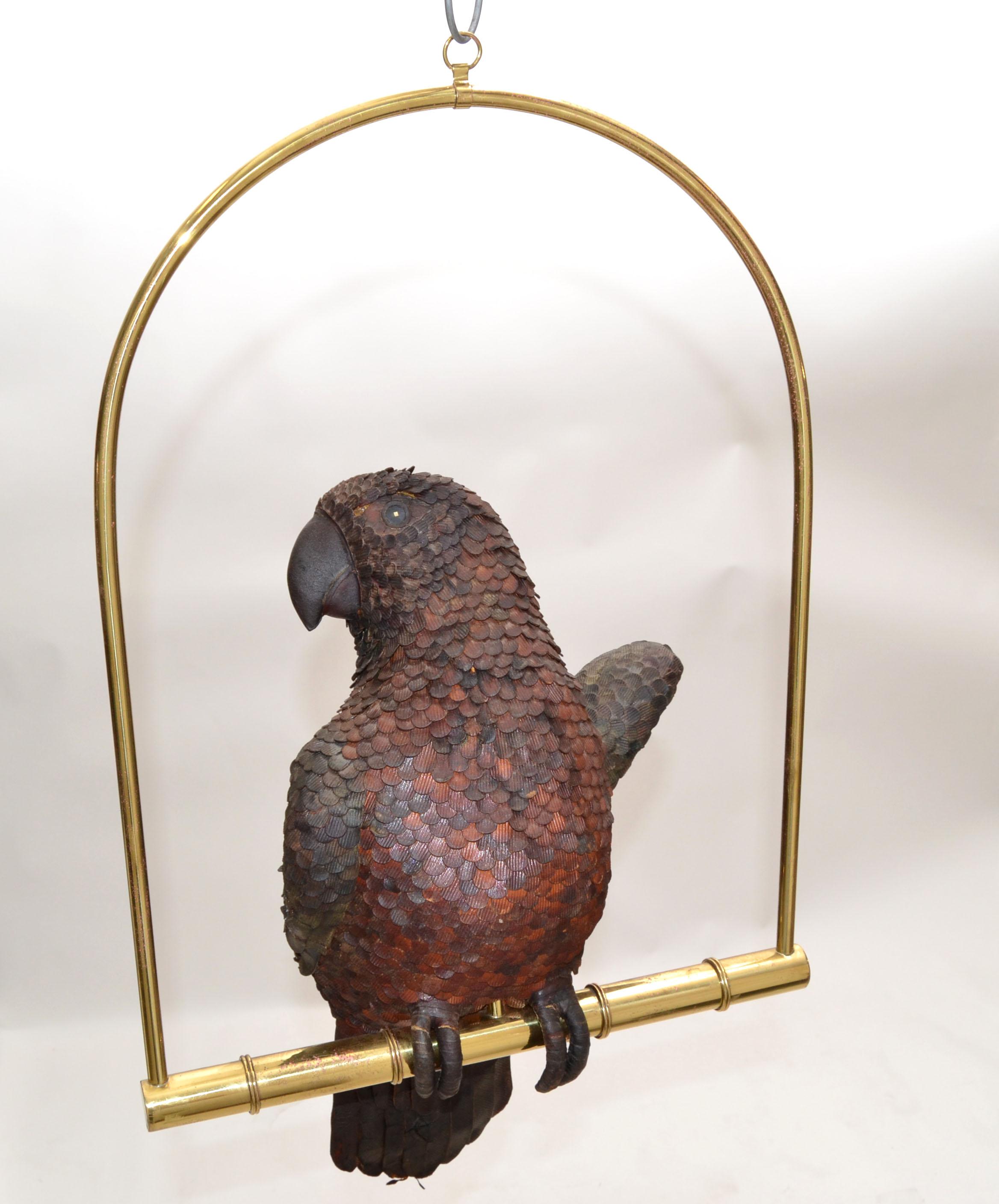 Signed 'FEDERICO in Mexico' leather parrot on a brass swing hand-crafted.
Beautiful animal sculpture.
Swing measurements: 19 inches height x 14 inches wide.
Parrot 17 inches Height.
Parrot with the swing 25 inches height.