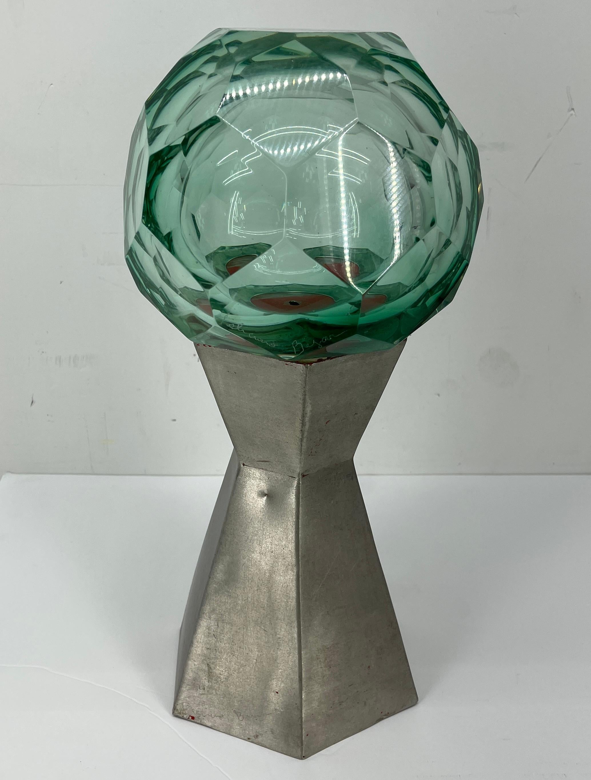 Cut glass and brushed aluminum table sculpture by Feliciano Béjar (1920-2007), Mexico, 1990's. 
His art sculptures dating from the 1960's through 1990's uses glass ground with either optic bubbles or beveled surface on both sides of the glass,