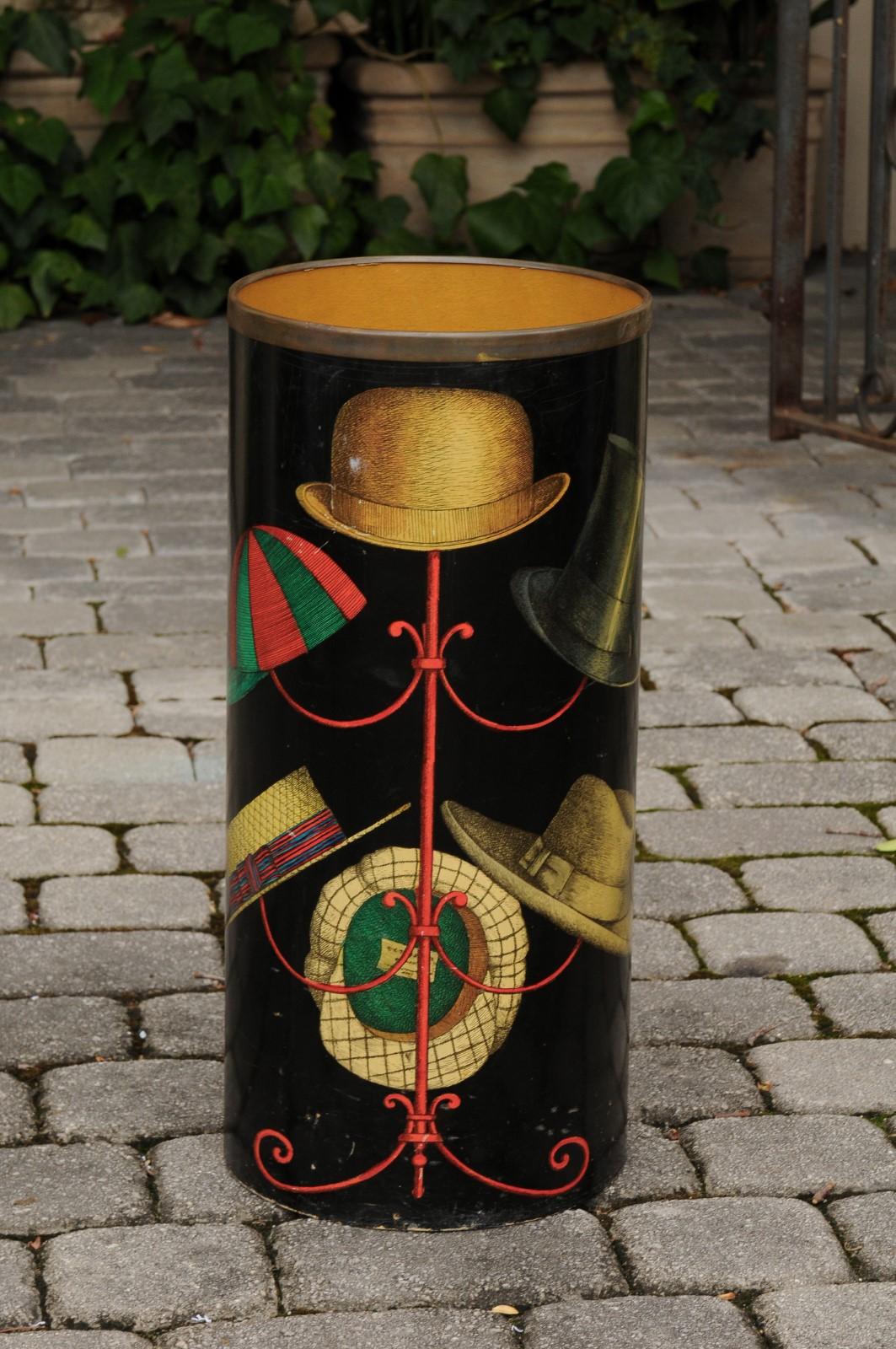 An Italian vintage lacquer umbrella stand with brass trim from the mid-20th century, signed Fornasetti. Born in Italy during the 1960s, this umbrella stand was created by Piero Fornasetti who founded in the Fifties the design and decorative arts